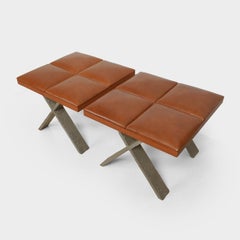 CARACALLA, Pair of cast aluminium and genuine leather stools, by Elitis, 2004