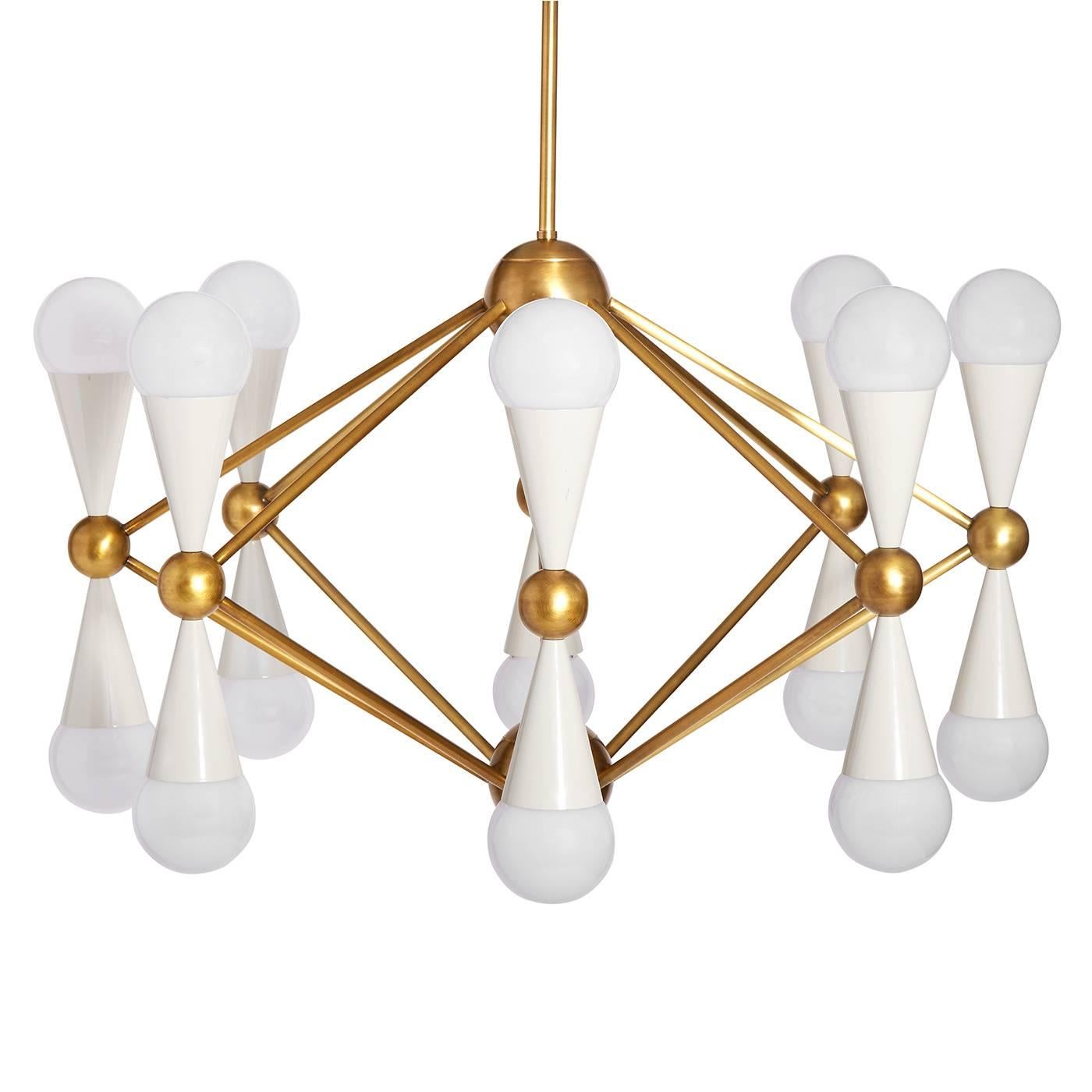 Kinetic modernism. Simple geometric shapes cones and spheres collide with dynamic results. Ideal scale for a dining room or a spacious foyer, the architectural Caracas sixteen-light chandelier will wow your world. Antiqued brass and glossy white