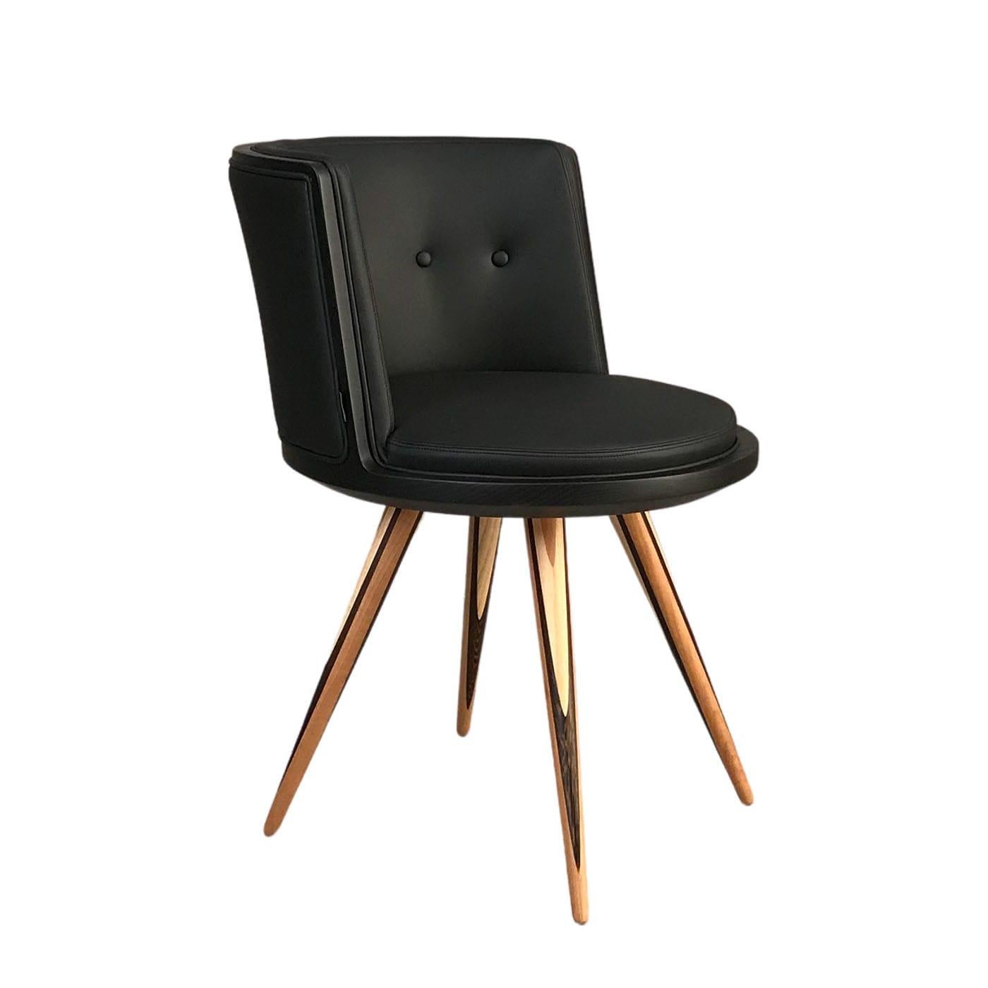 An elegant accent to a contemporary study or living room, this stupendous chair exudes comfort and sophistication. Handmade of ash wood lacquered in a black shade, the round seat is softly padded and upholstered with black leather, matching the