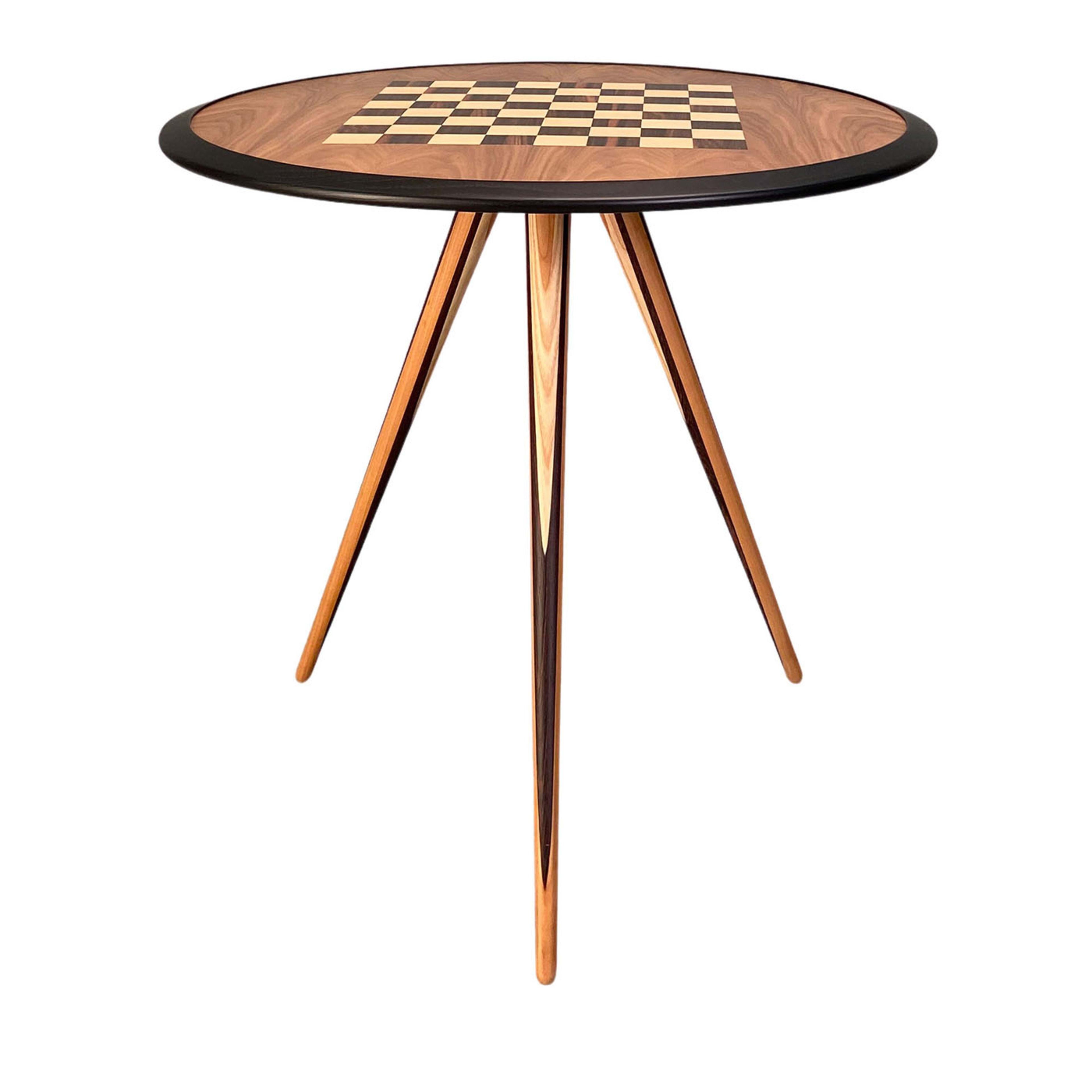 Imbued with utmost refinement, this stupendous side table is a deft display of traditional craftsmanship. Its round top is handmade of ash wood lacquered in an ebony shade, enriched with walnut, maple, and Makassar ebony inlay work of a chessboard.