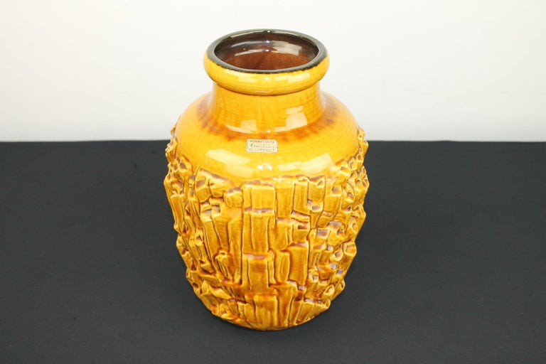 Vintage caramel brown, dark yellow vase by Tönnieshof Carstens, Western-Germany, 1960s.
This W-German Fat Lava vase has a beautiful design and is numbered 7582-30 Western-Germany. 
The original label is still on the vase: Tönnieshof