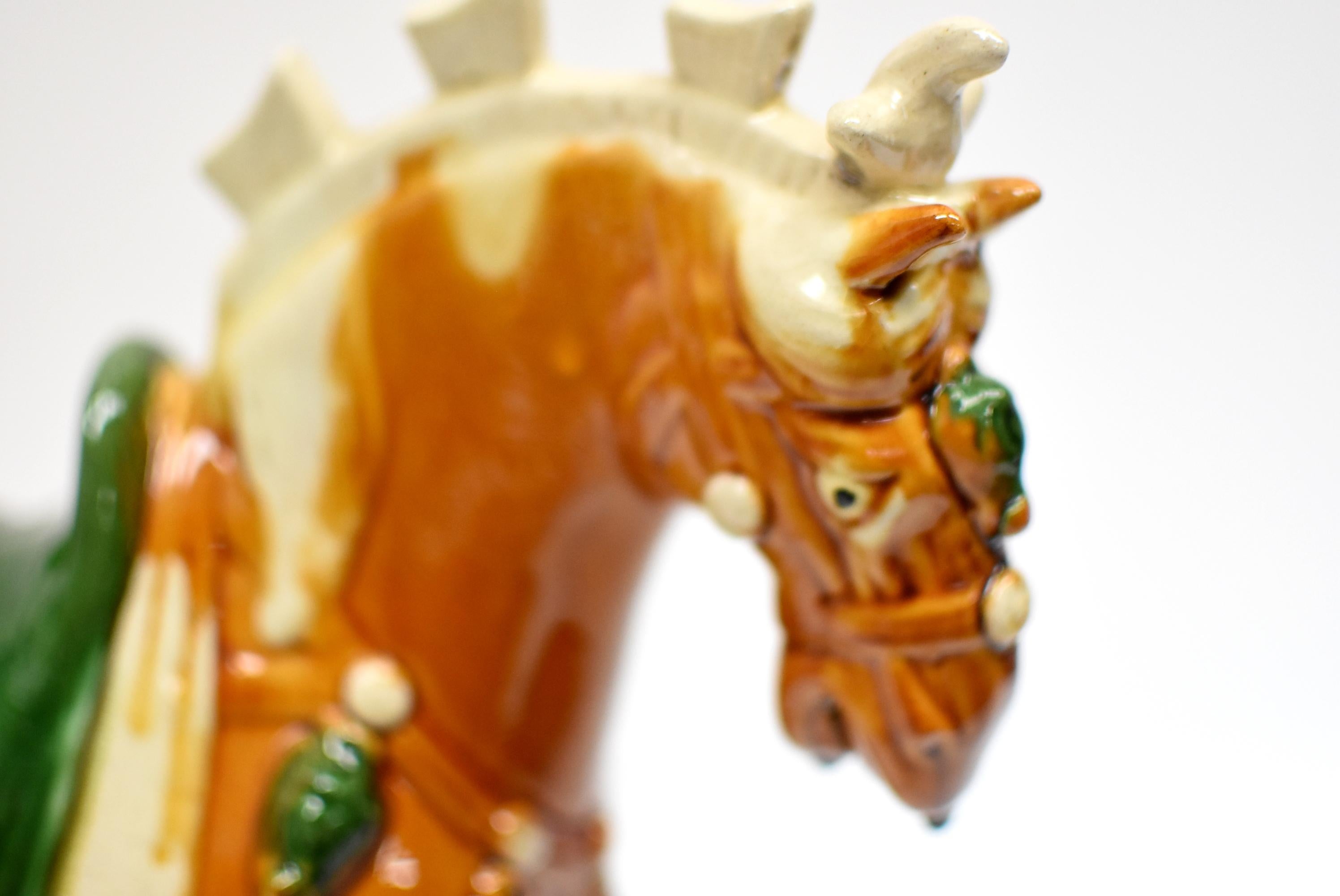 A beautiful caramel San Cai horse in high gloss. The Sancai technique dates back to the Tang dynasty (618–907AD). It produces highly artistic, refined sculptures with brilliant colors and glazes. This horse has well defined muscles and calm