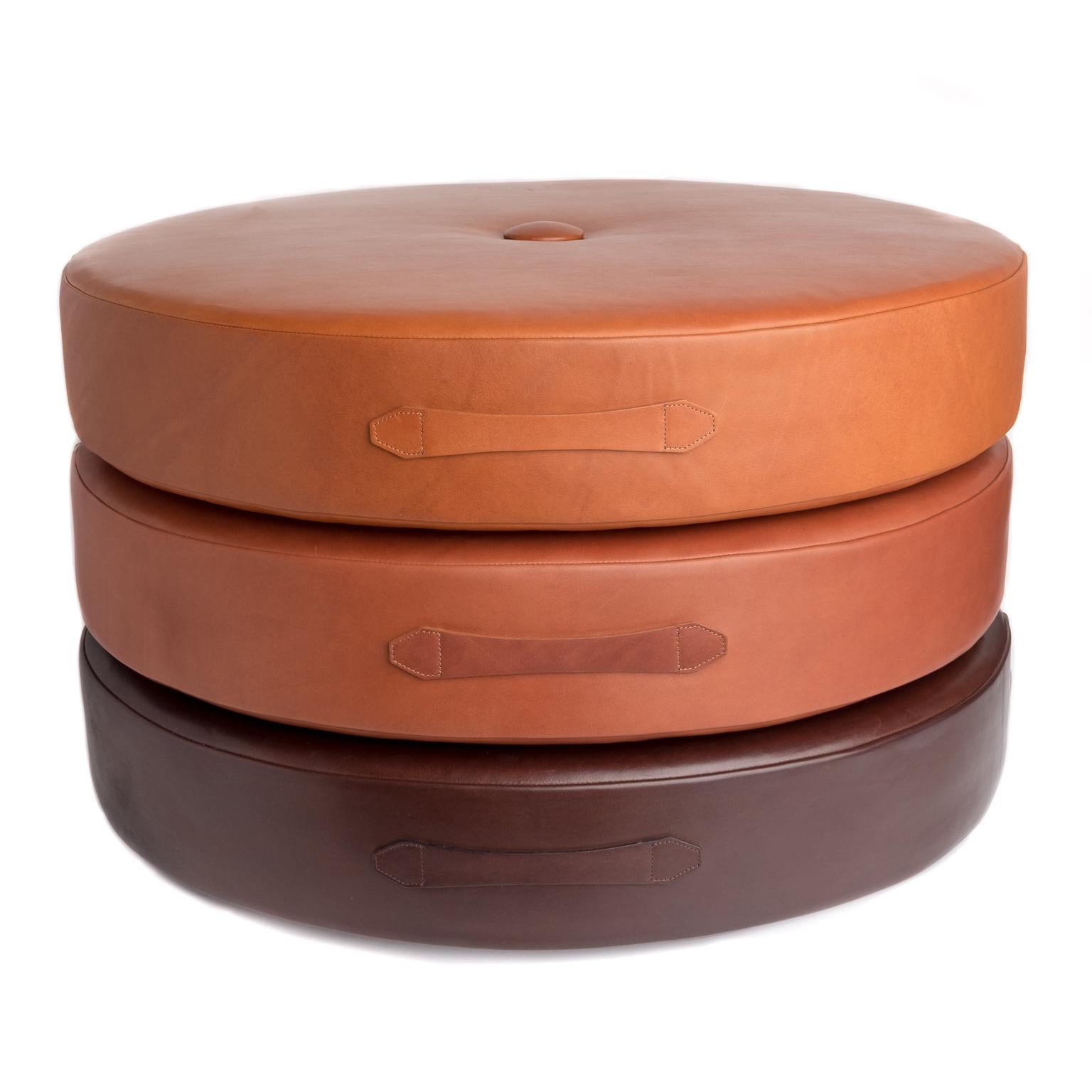 Designed to wake up your space with additional seating, accent decor and cozy chill zones, these low-profile circular leather floor cushions can be easily moved or stashed away. Also available as a set of three (separate listing). 

Construction: