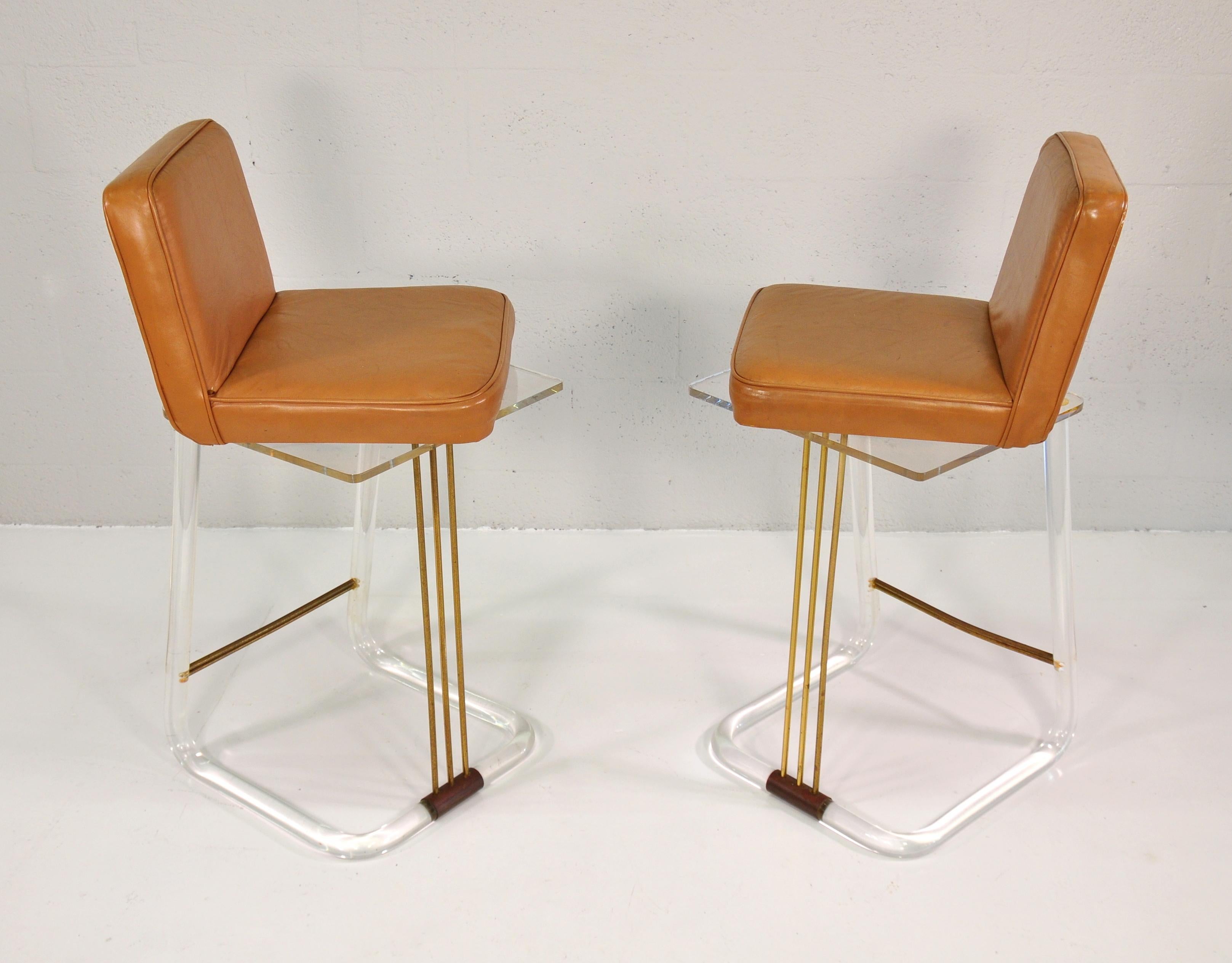 American Caramel Leather and Lucite Swivel Bar Stools by Lion in Frost