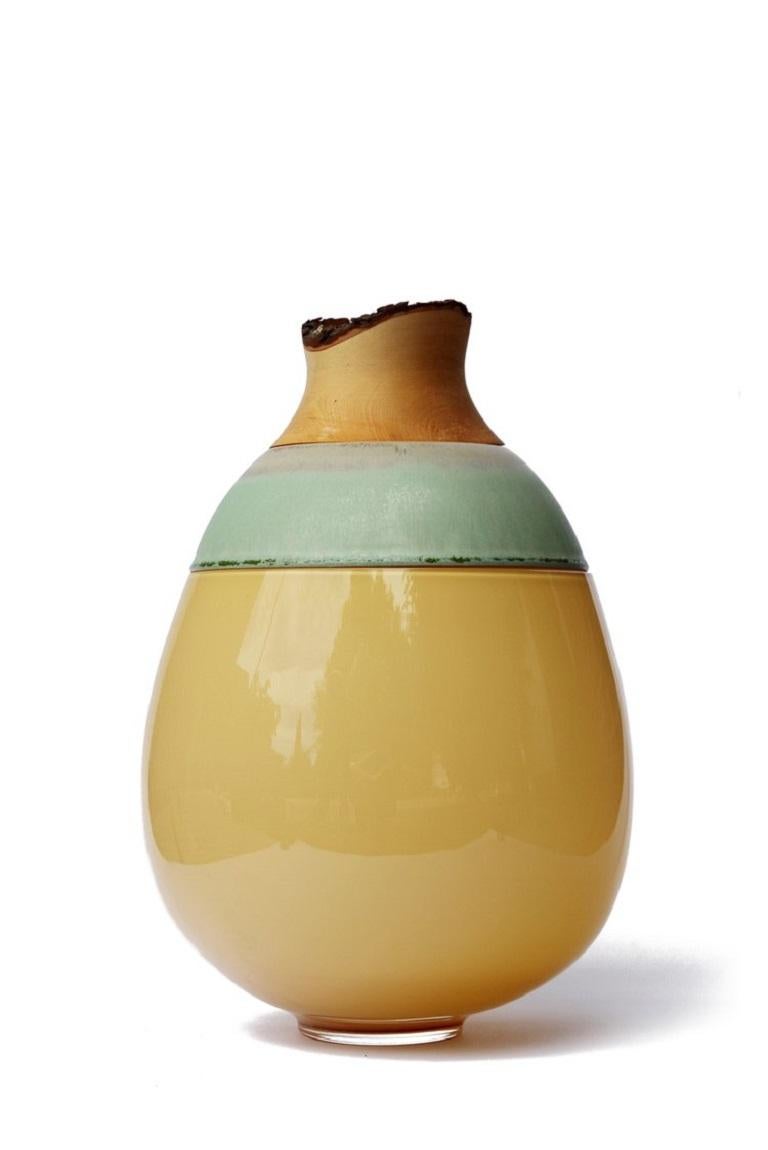 Caramel Paradise Lilith stacking vessel, Pia Wüstenberg
Dimensions: D 25 x H 42.
Materials: glass, wood, ceramic.
Available in other colors.

A collection of two pieces, Eve & Lilith, combining large scale glass and stoneware ceramic with