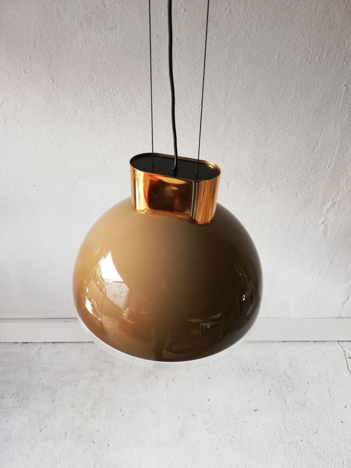 Caramel round glass pendant lamp by Staff, 1980s Germany

Very beautiful, heavy and rare design pendant lamp.

Lampshade is in very good vintage condition.

This lamp works with E27 light bulb.
Wired and suitable to use with 220V and 110V for