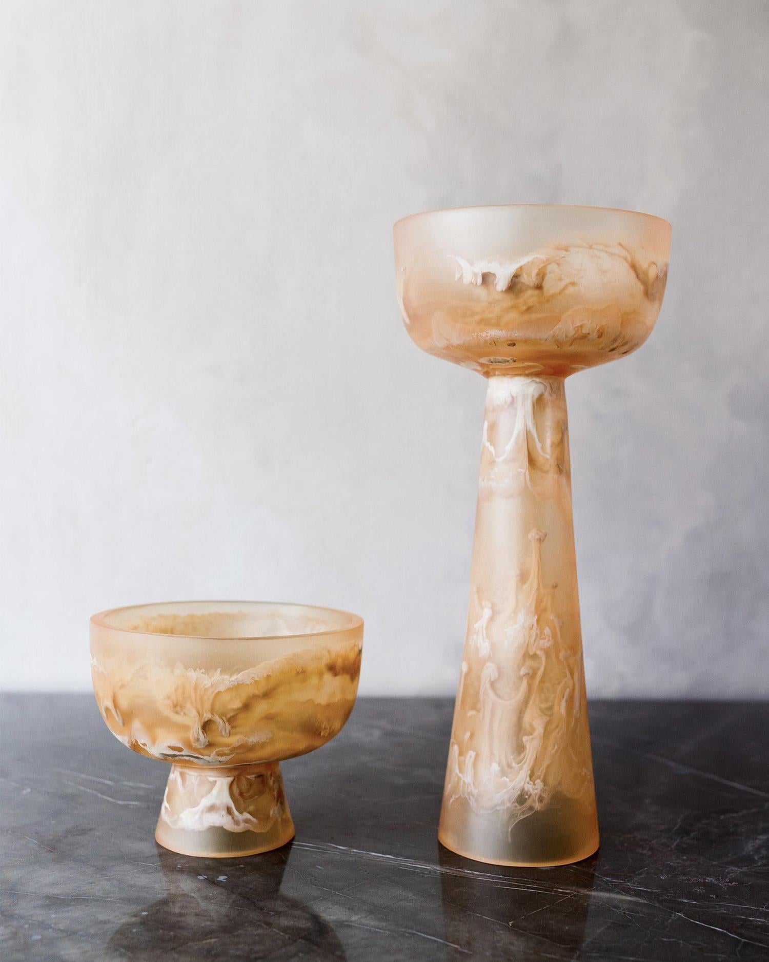 This caramel high resin pedestal bowl is a beautiful example of the artisanal craftsmanship that goes into each piece designed by Monica Calderon and handmade by expert artisans in Mexico. The high resin pedestal bowl in beige is made from a