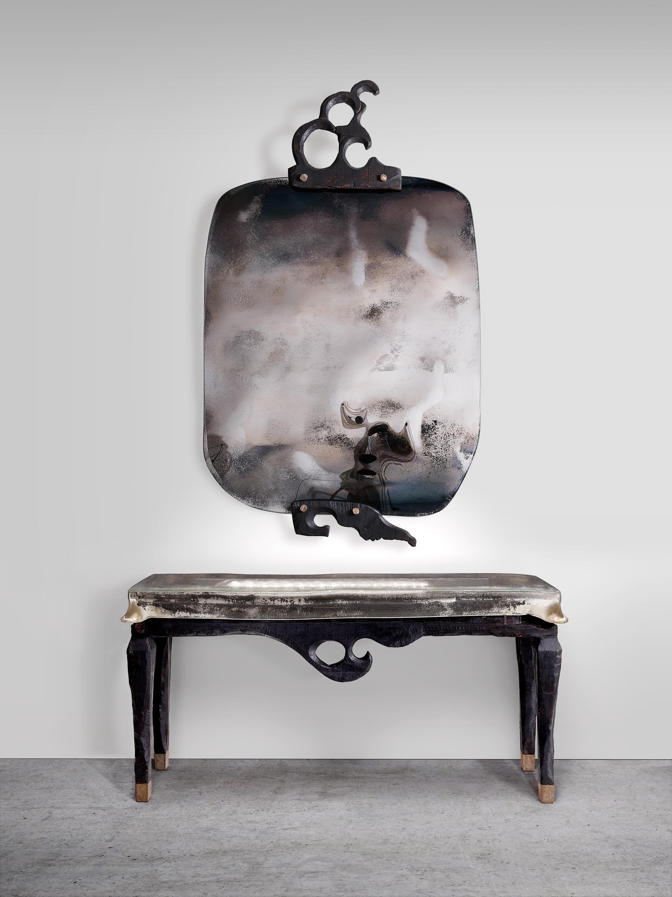 Carampana Console Table by Vetralia
Designed by Giovanni Luca Ferreri
Dimensions:  W 170 x D 50 x H 80 cm
Materials: Charred wood structure with thermoformed glass and engraved details. Included LED light bar.

VETRALIA
Functional Art based in