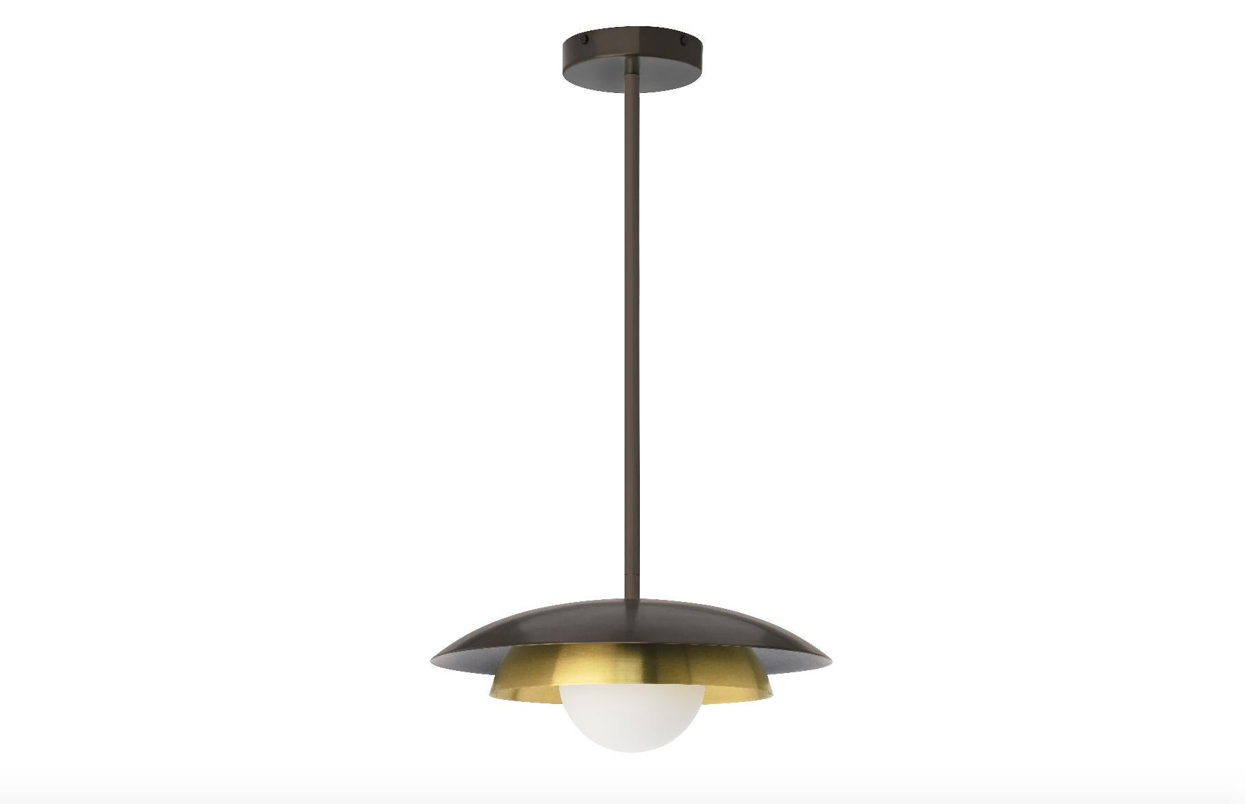 Carapace pendant lamp by CTO Lighting
Materials: bronze with satin brass, opal glass shade and bronze drop rod
Dimensions: H 15 x W 32 cm

All our lamps can be wired according to each country. If sold to the USA it will be wired for the USA for