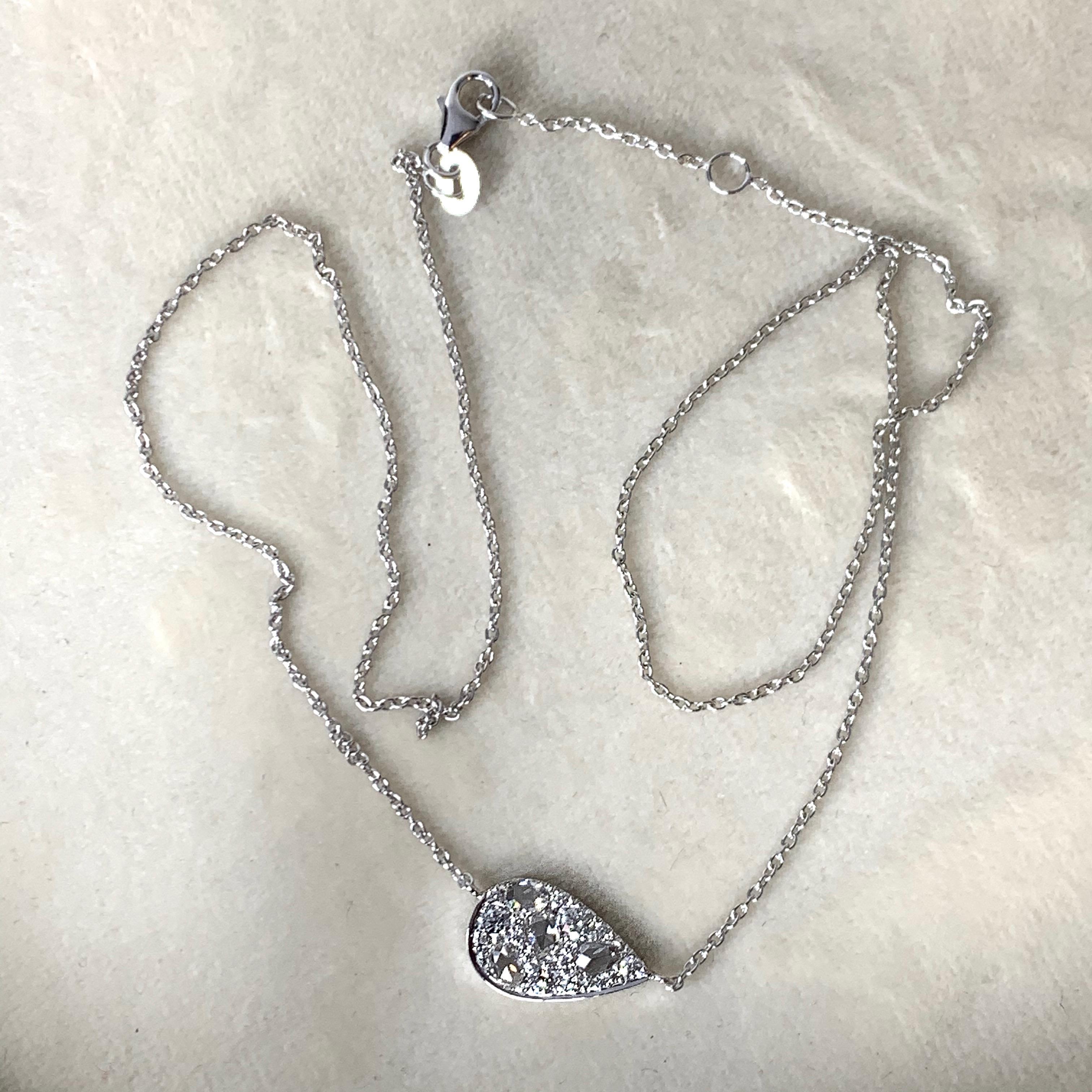 Pendant with neclace handmade ( no casting involved) in Belgium by jewellery artist Joke Quick in 18K white gold 3,6 g pave set with white GHVS rose-cut diamonds 0,37 ct., white DEGVVS brilliant-cut diamonds 0,305 ct.;  Total carat : 0,675 ct..
