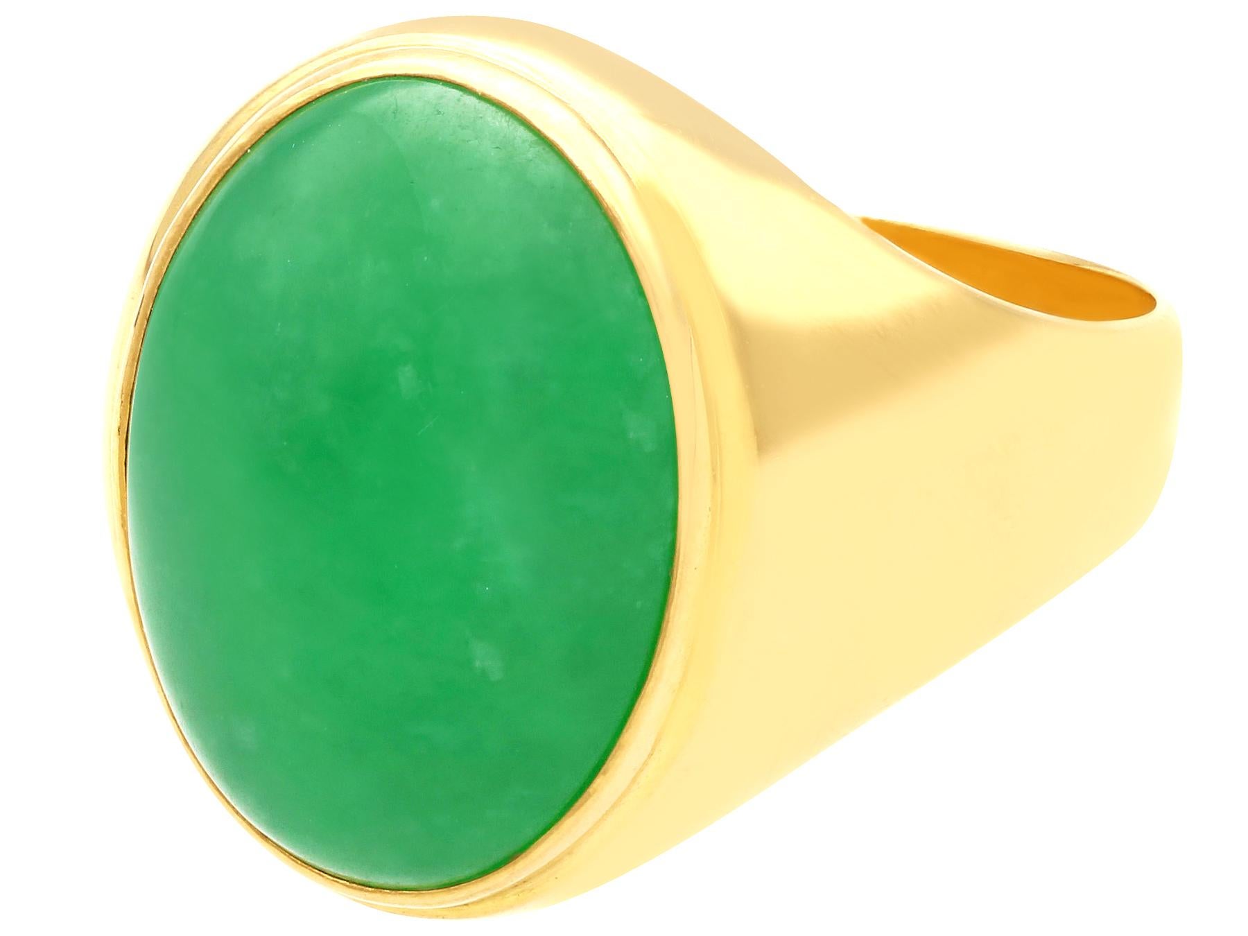 An impressive vintage 1990s 12.95 carat jade and 18 karat yellow gold cocktail ring; part of our diverse vintage jewelry and estate jewelry collections.

This fine and impressive vintage cabochon cut gemstone ring has been crafted in 18k yellow