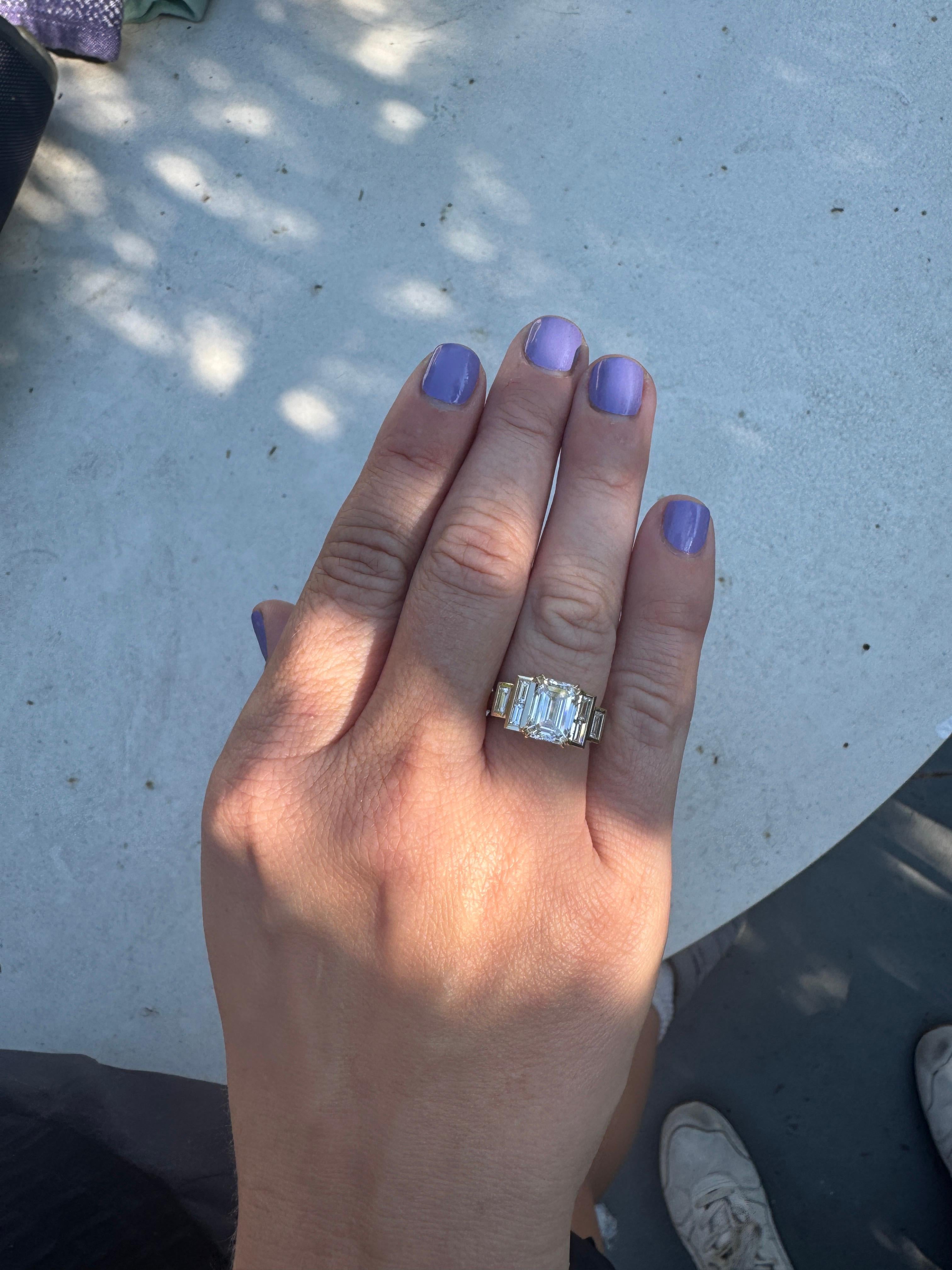 Indulge in timeless sophistication with this handcrafted 3.00 total carat weight ring, designed to captivate from every angle. The centerpiece is an approx. 2.5 carat lab-grown emerald-cut diamond, D–F color and VVS–VS clarity, celebrated for its