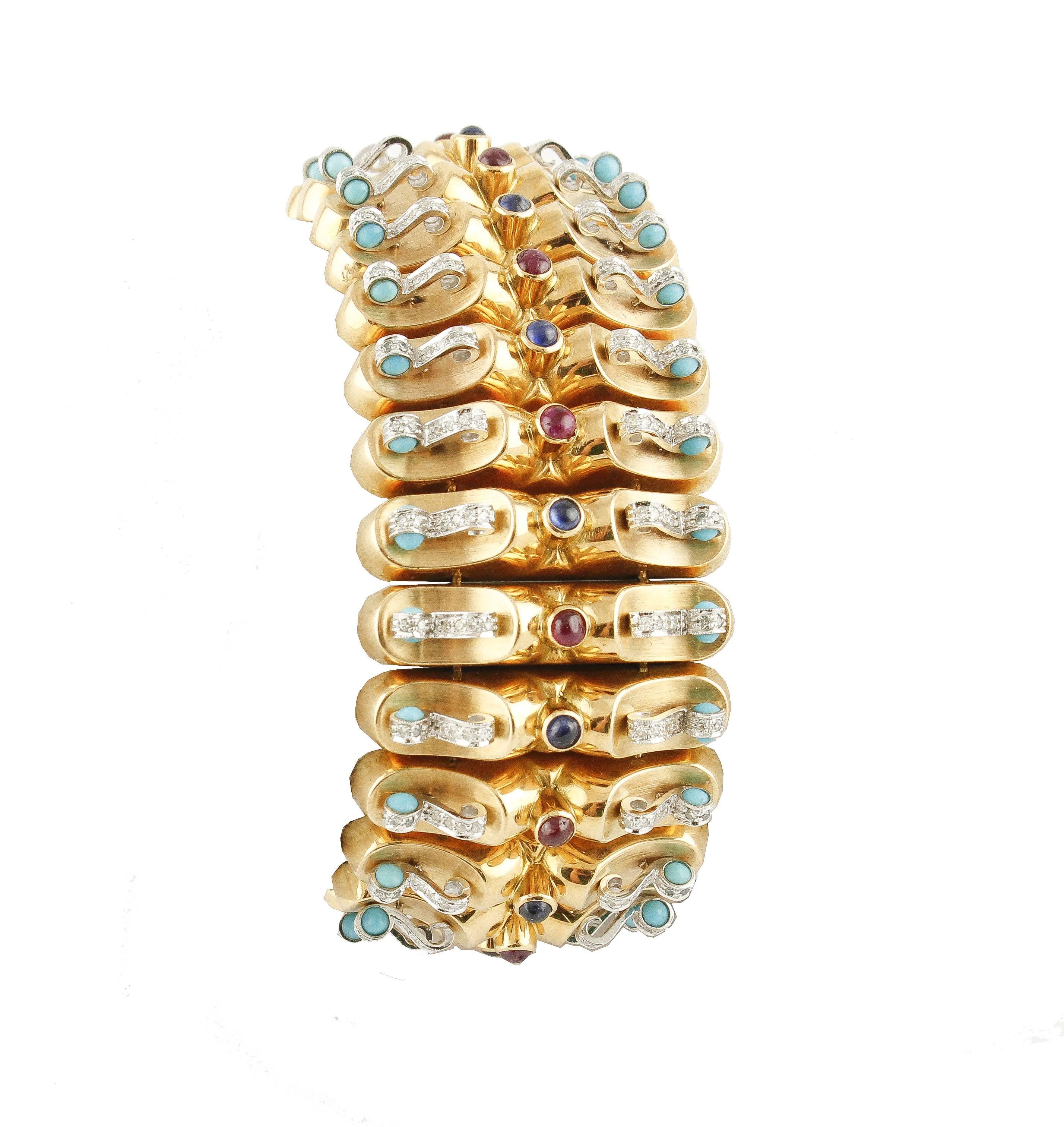 Elegant bracelet in 18 kt yellow gold, with a unique design, all studded sideways on both sides by diamonds and turquoise beads. There are  precious cabouchon stones of sapphires and rubies in the center.
Diamonds ct 2.39
Blue Sapphires and Rubies