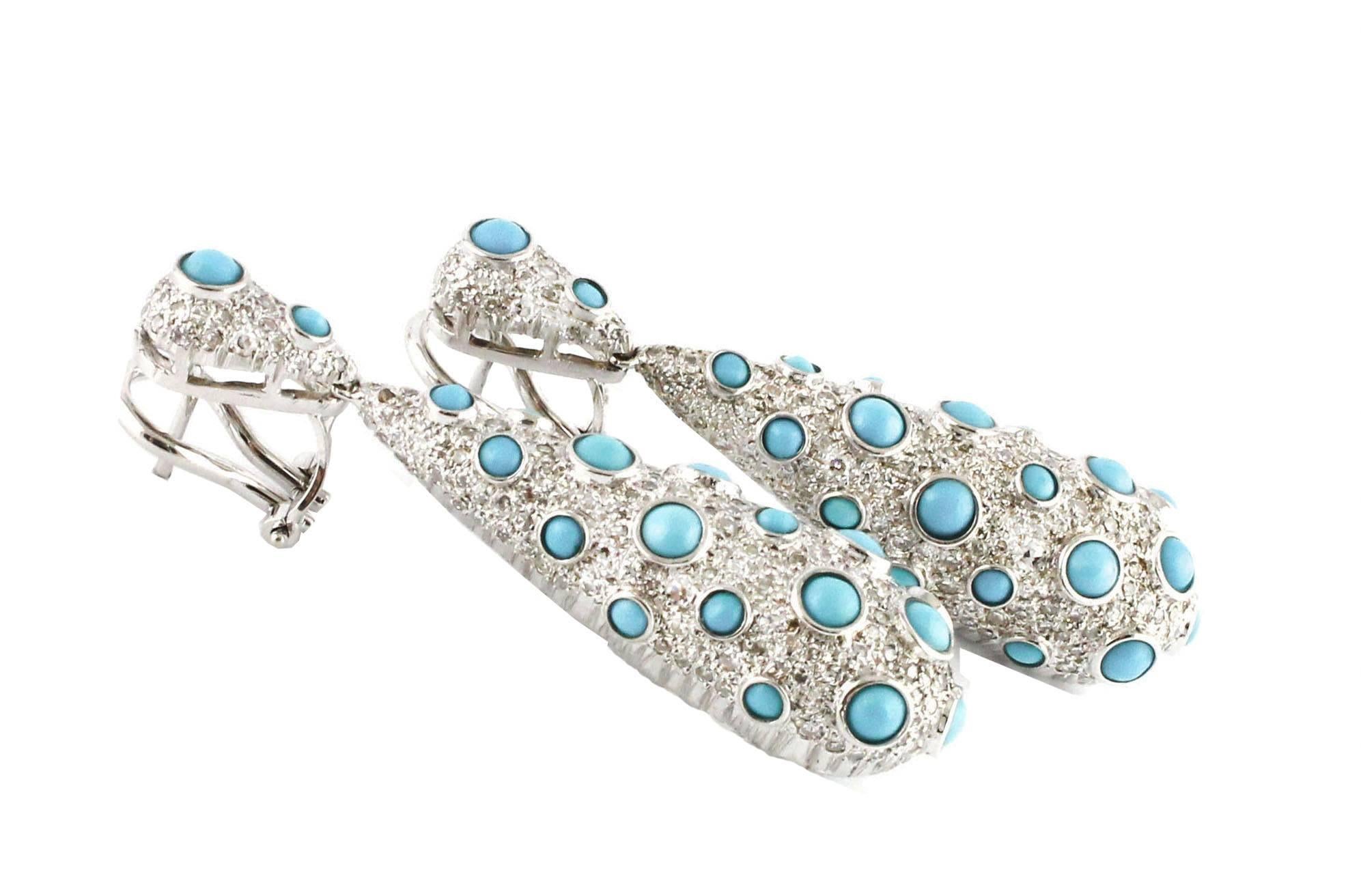 
Charming 14 kt white gold dangle earrings, with 3.37 ct diamond , and beautiful turquoise stones 0.70 g 
Diamonds ct 3.74
Turquoise g 0.70
Total weight g 19.50
R.F + eaif

For any enquires, please contact the seller through the message center.