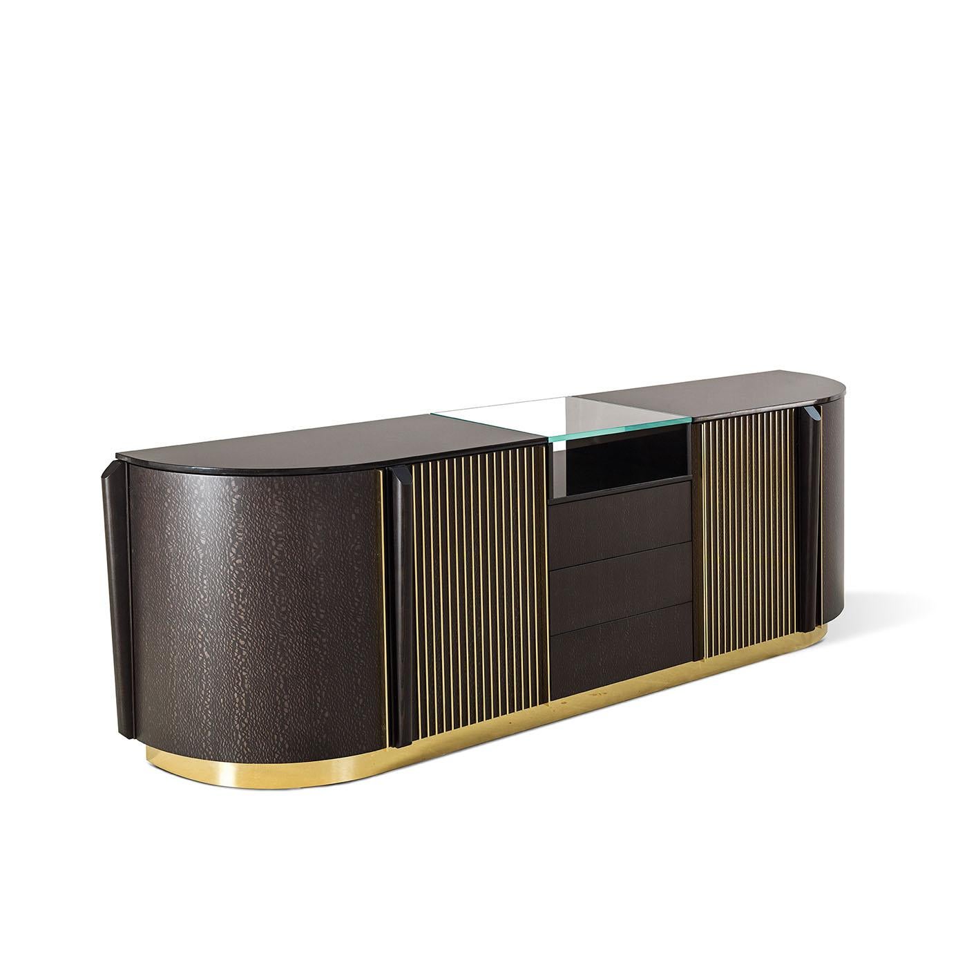 This sideboard is crafted from carvalho wood with brass details and a Nero Assoluto marble top.
