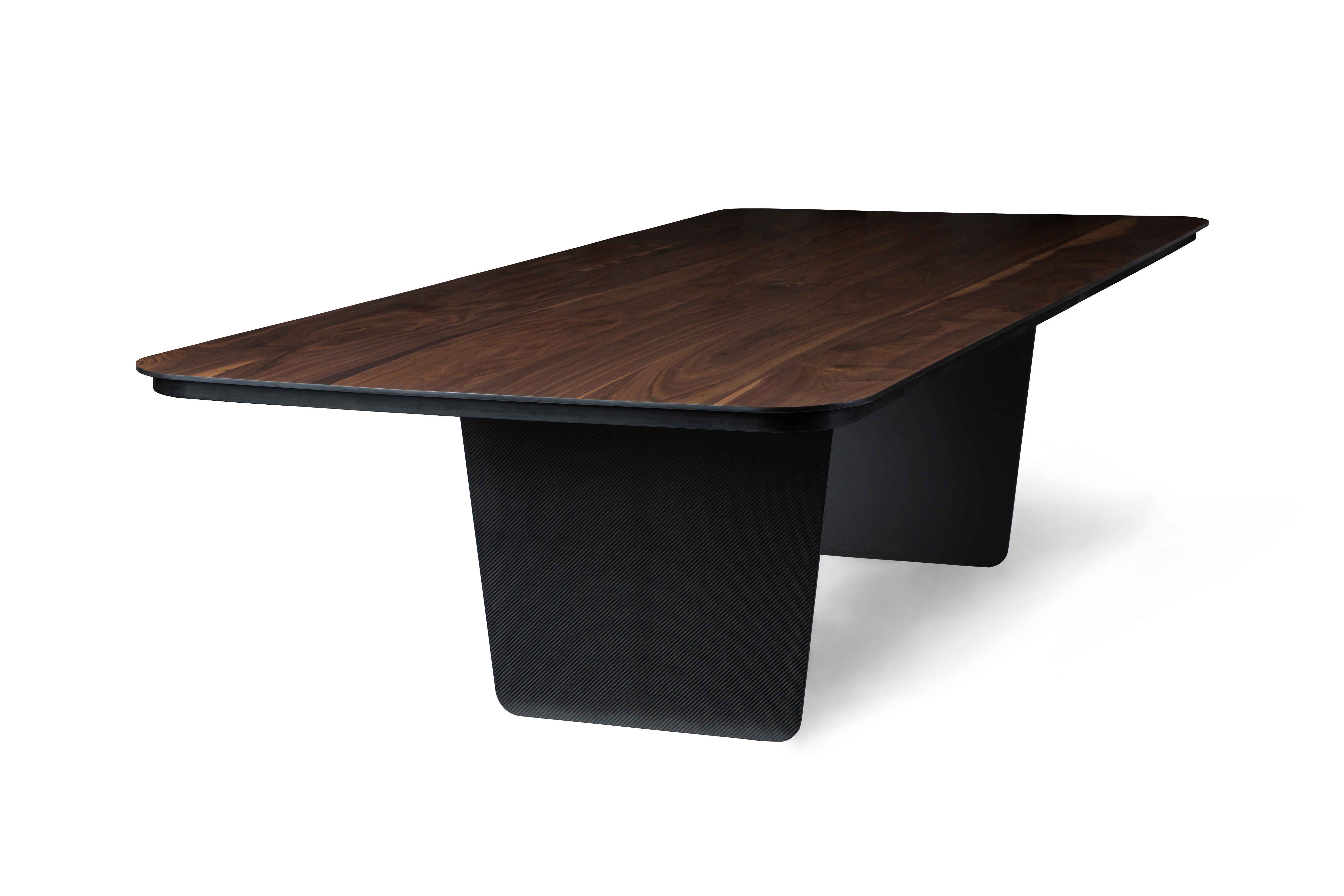 Carbon Claro table by Tokio
Dimensions: D 130 x W 300 x H 75 cm.
Materials: walnut, carbon fiber.

Asobi is a creative consultancy specializing in product design and brand development. The company made its acclaimed debut in 2005 at the London