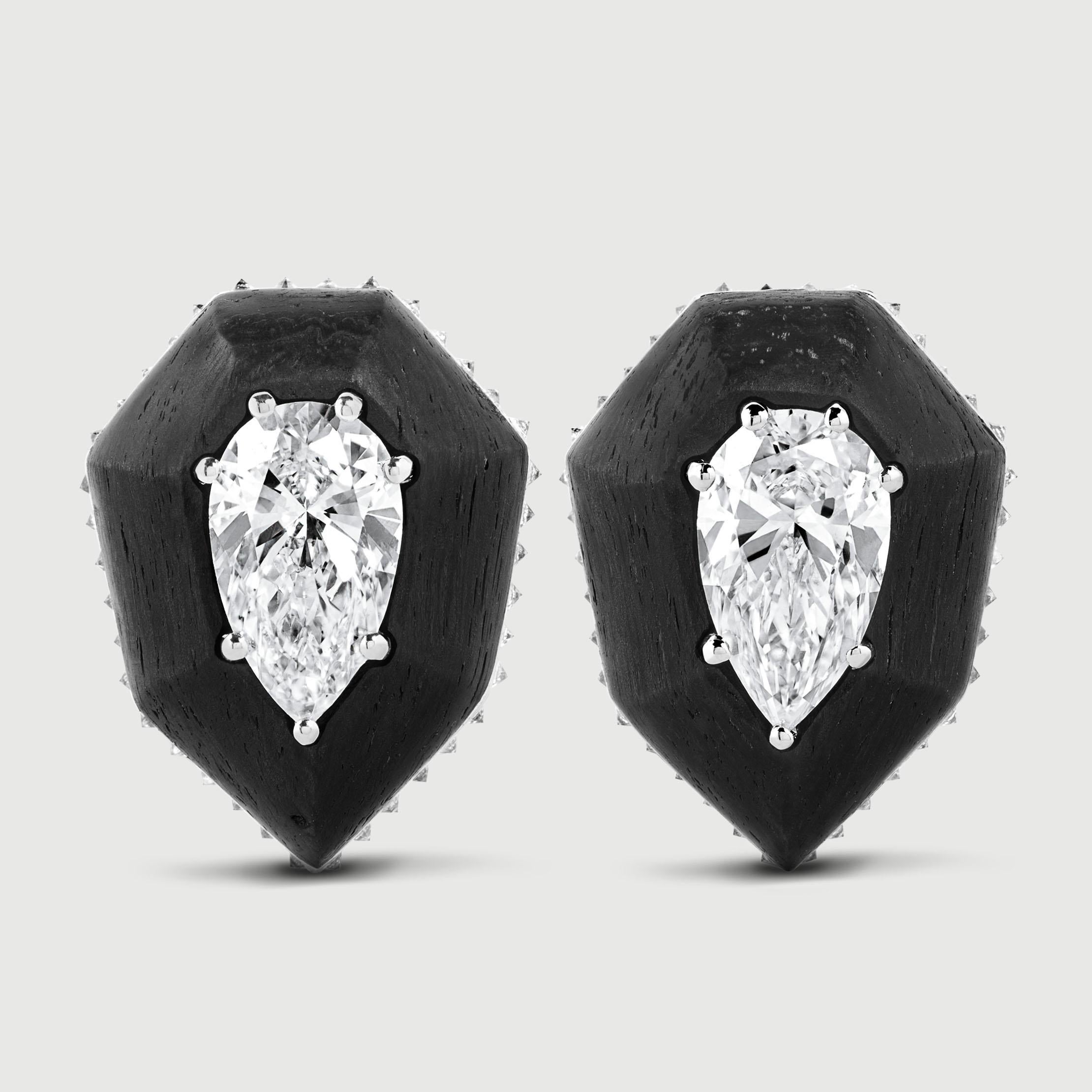 Earrings hand crafted in Carbon Fiber with Removable Jackets, White Diamonds 2.01 carats centre stones plus 0.4 carats pave (total 2.41 carats). 18K White Gold 8.2 gr. The carbon frame is removable so the earrings can be worn with or without it. 