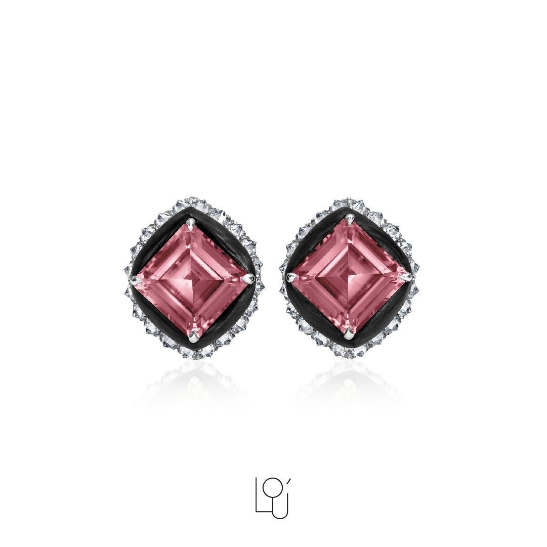 Earrings handcrafted in Carbon Fiber, reverse set White Diamonds 2.1 ct., 18W gold 6.0 gr., Malaya Garnet 10.2 ct. total (stone size 10x10x6 mm each). Stones are natural and not treated. 

Intricate work in carbon fiber is done by hand by highly