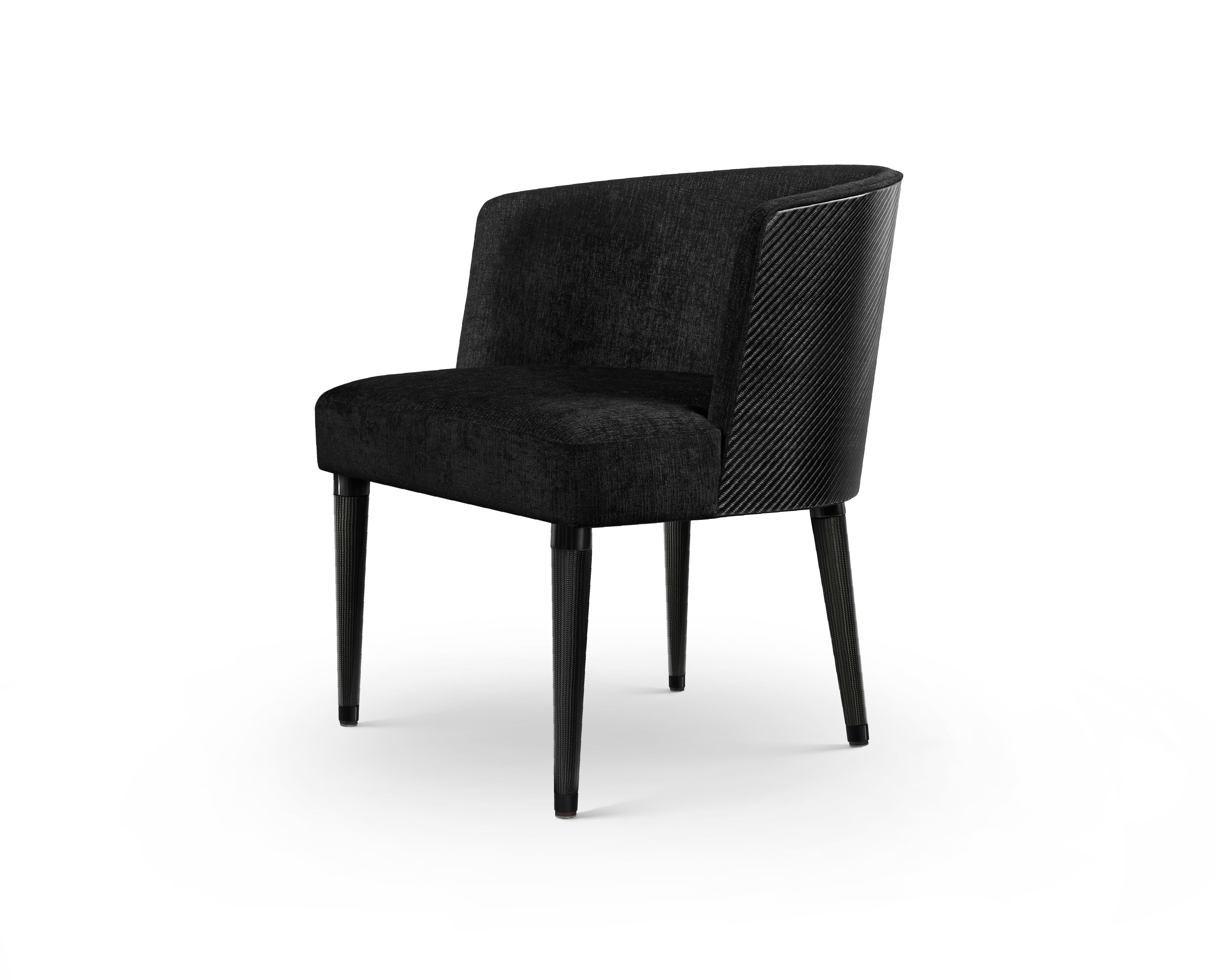 Carbon fibre and upholstered Norton armchair by Madheke
Dimensions: W 58 x D 61 x H 71.5 cm
Materials: Leather, fabric, wood, metal

NORTON's sleek glossy curves and contours are expertly crafted from carbon fibre at the back and leg which