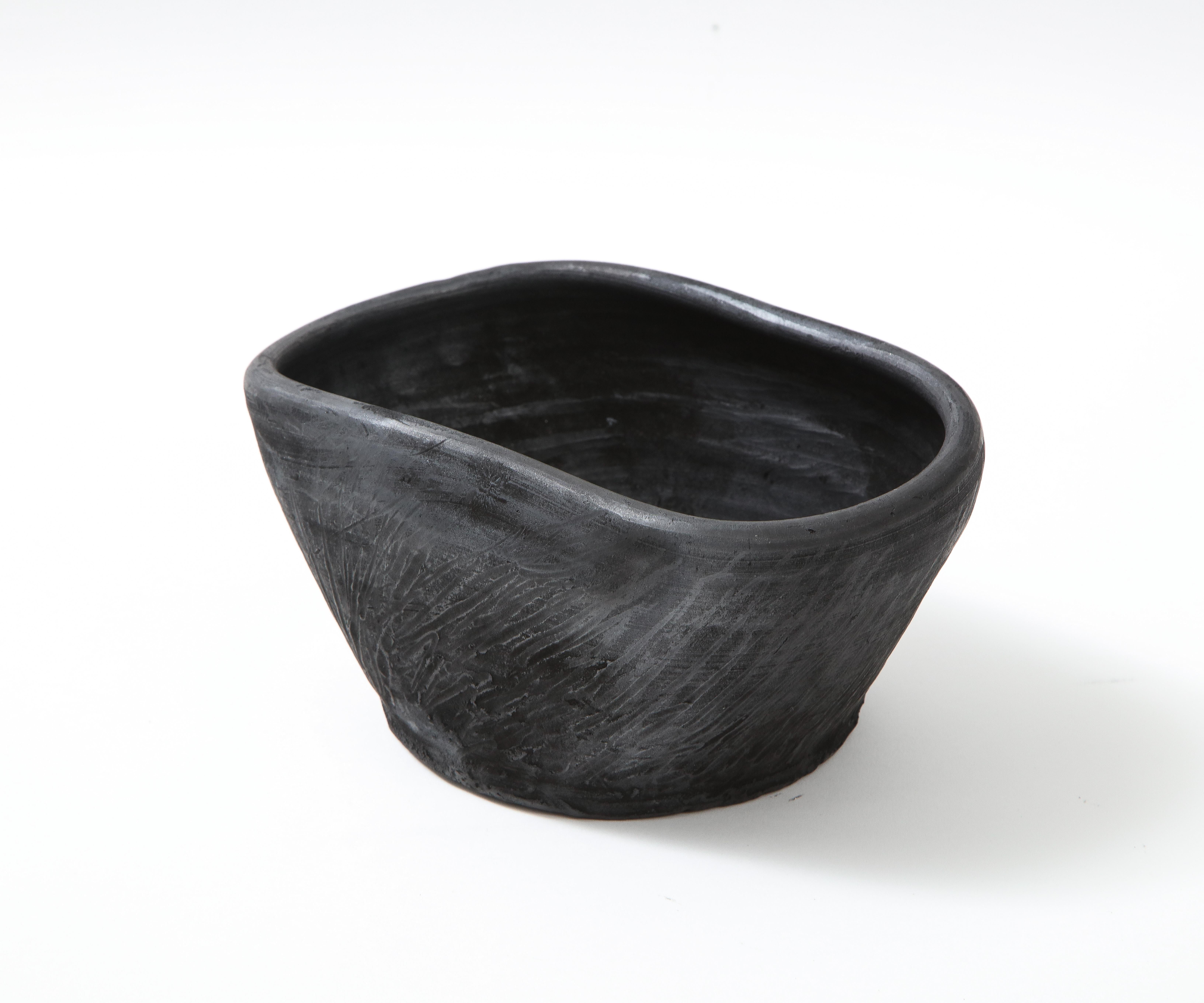 Brutalist terracotta bowl. Uniquely cooked directly on charcoal. Made exclusively for Facto Atelier Paris. Silver reflections. Not suitable for food contact. Different sizes available.