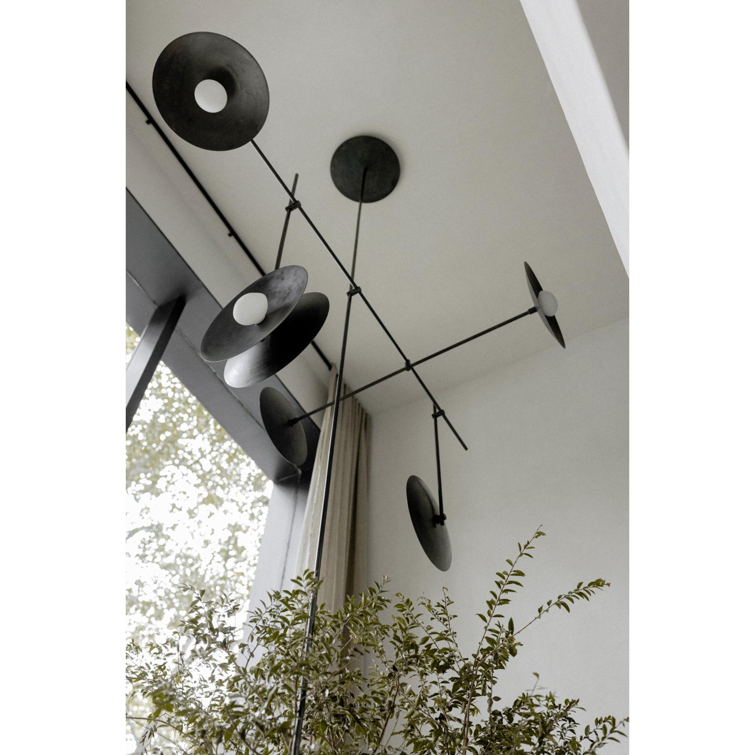 Carburo Pendant Lamp Fixture in Blackened Steel by Nuumbra
Dimensions: D 130 x W 210 x H 400 cm. 
Materials: Blackened steel and brass.

Available in steel or brass. Prices may vary. All our lamps can be wired according to each country. If sold to