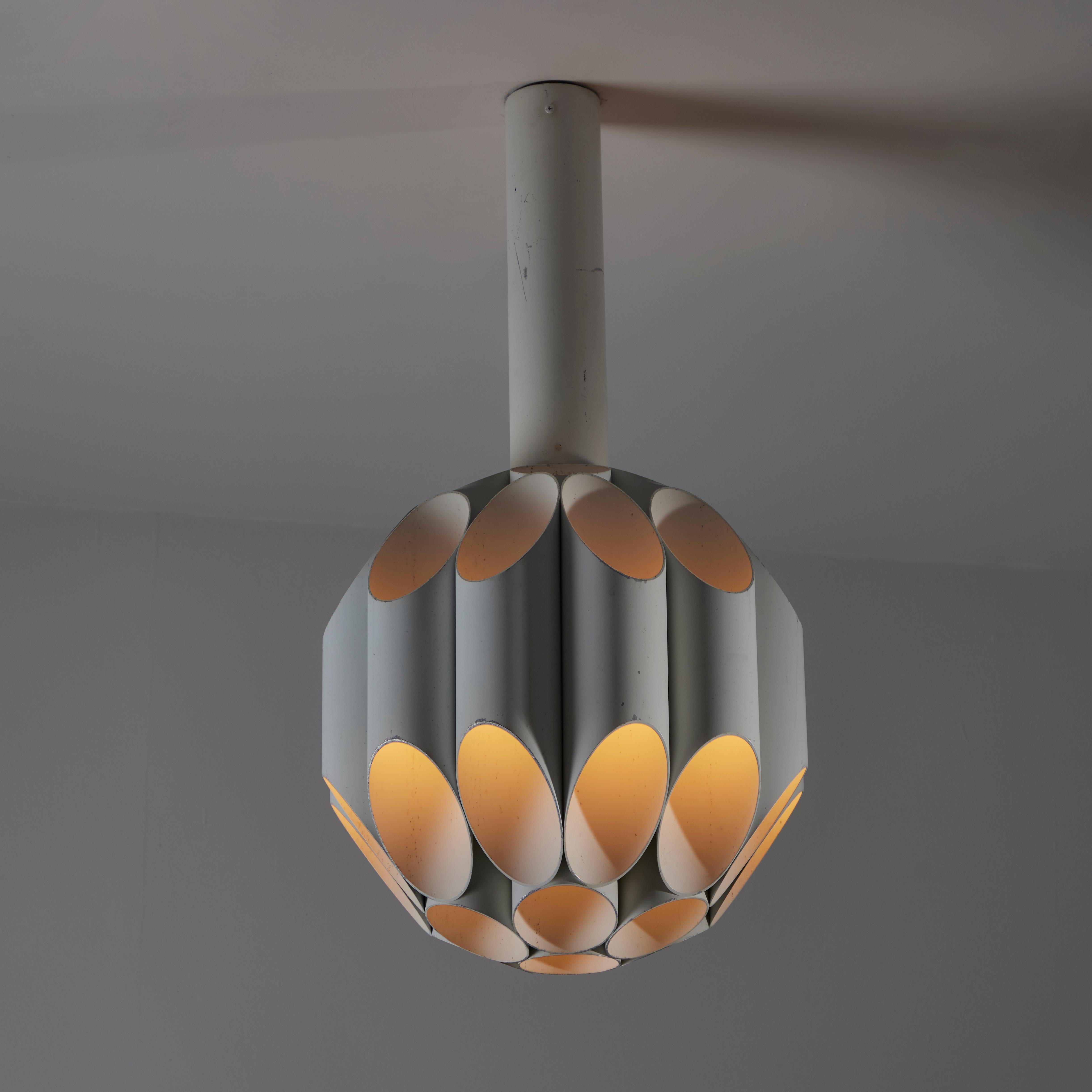 Single 'Carciofo' ceiling light by Gianni Celada for Fontana Arte. Designed and manufactured in Italy, circa the 1970s. Enameled metal pipe flutes make there way around to form what resembles a honeycomb body. Each flute holds a single E14 socket