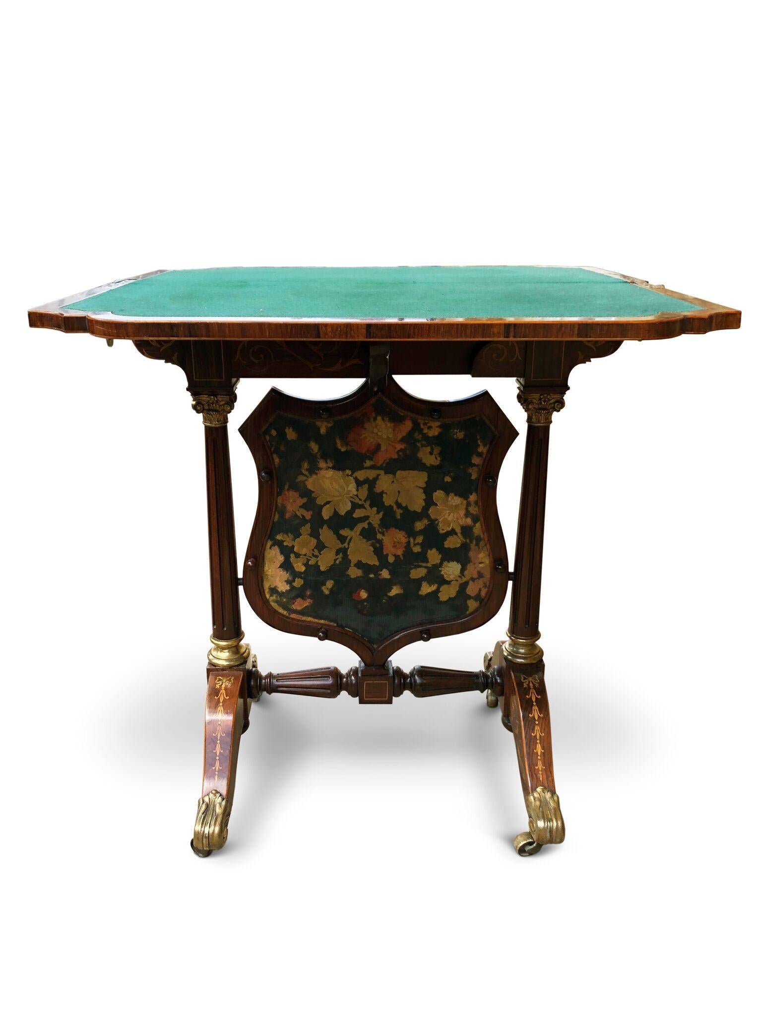 A very rare superb folding card table with fire screen.
Rosewood with Floral inlay throughout. The table folding upright when closed with brass turned stopping mechanism holding it in place, to be used as fire screen with the panel below.
The