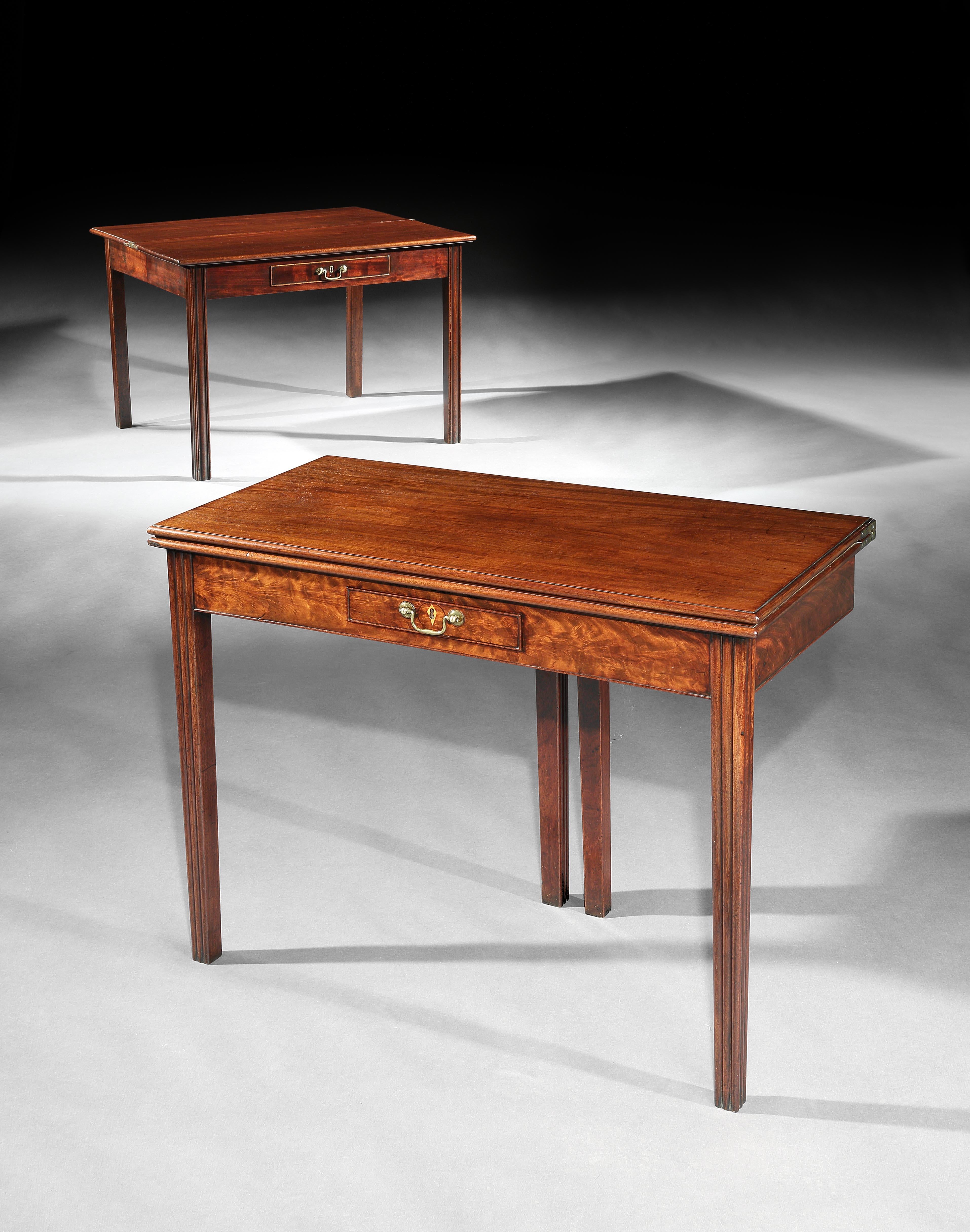 These card tables are the same model with some minor differences; one has a plum pudding figured frieze and boxwood escutcheon and the other is slightly larger. It is difficult to source pairs of tables and these came from the same collection. They
