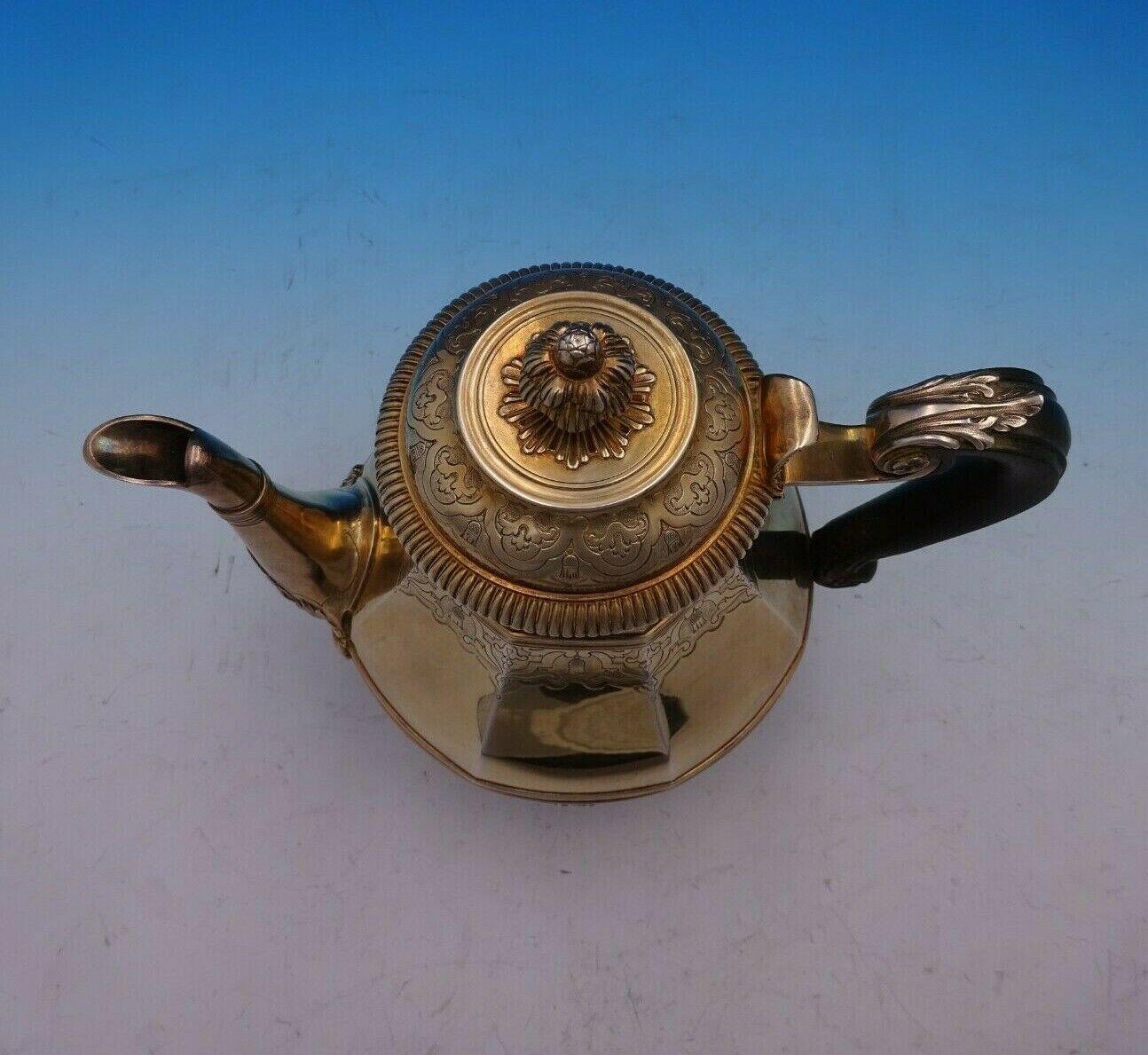 Cardeilhac

Stunning Cardeilhac Paris French .950 silver vermeil tea pot with ebony handle. This piece features a wide base of raised cattails and design. There is a large figural Grecian woman at the base of the spout, as well as three wide bands