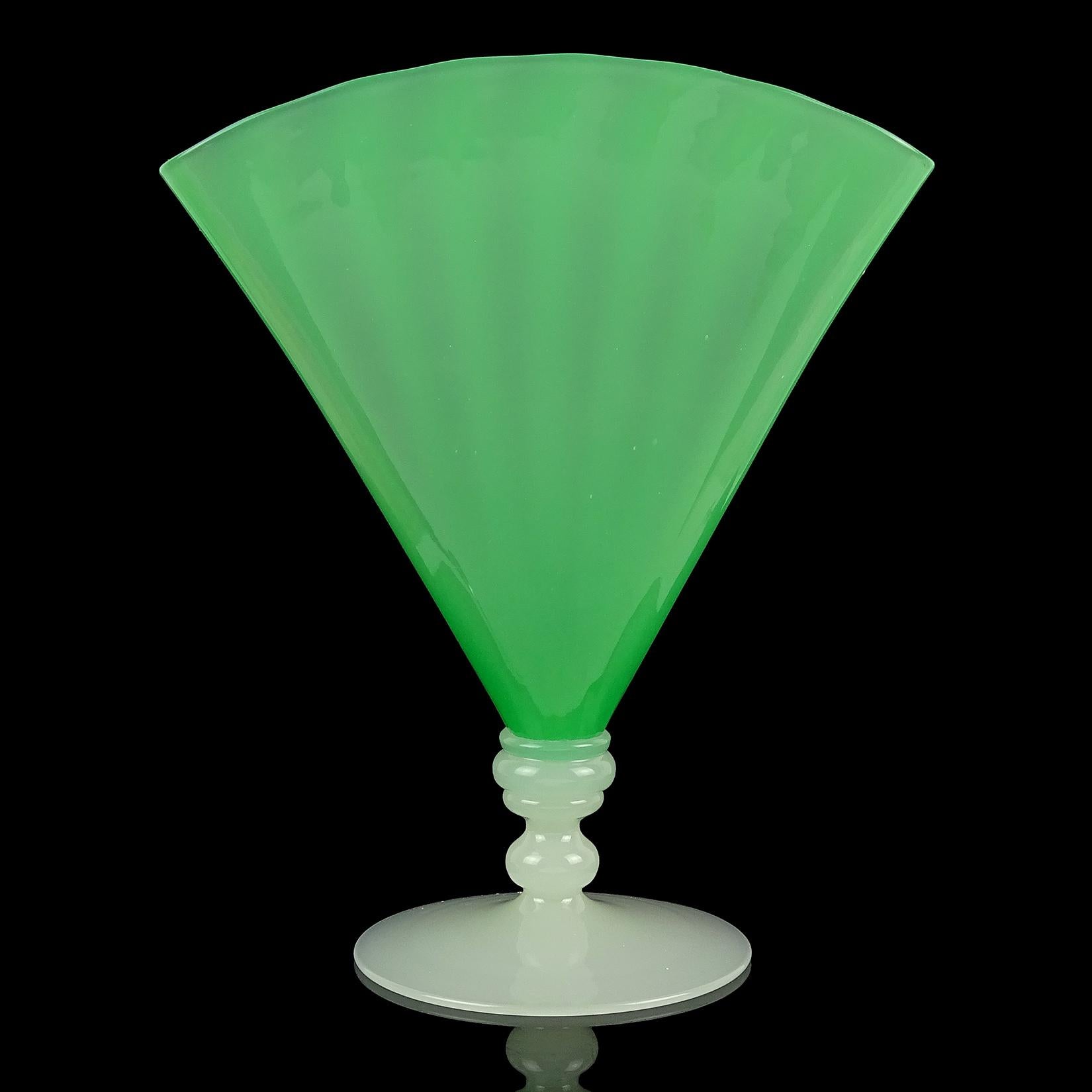 Beautiful hand blown, Frederick Carder era, Steuben style jade green with alabaster white art glass fan vase. The fan vase has a slight ribbed pattern. It is raised on an alabaster baluster form stem and round domed base, with polished pontil
