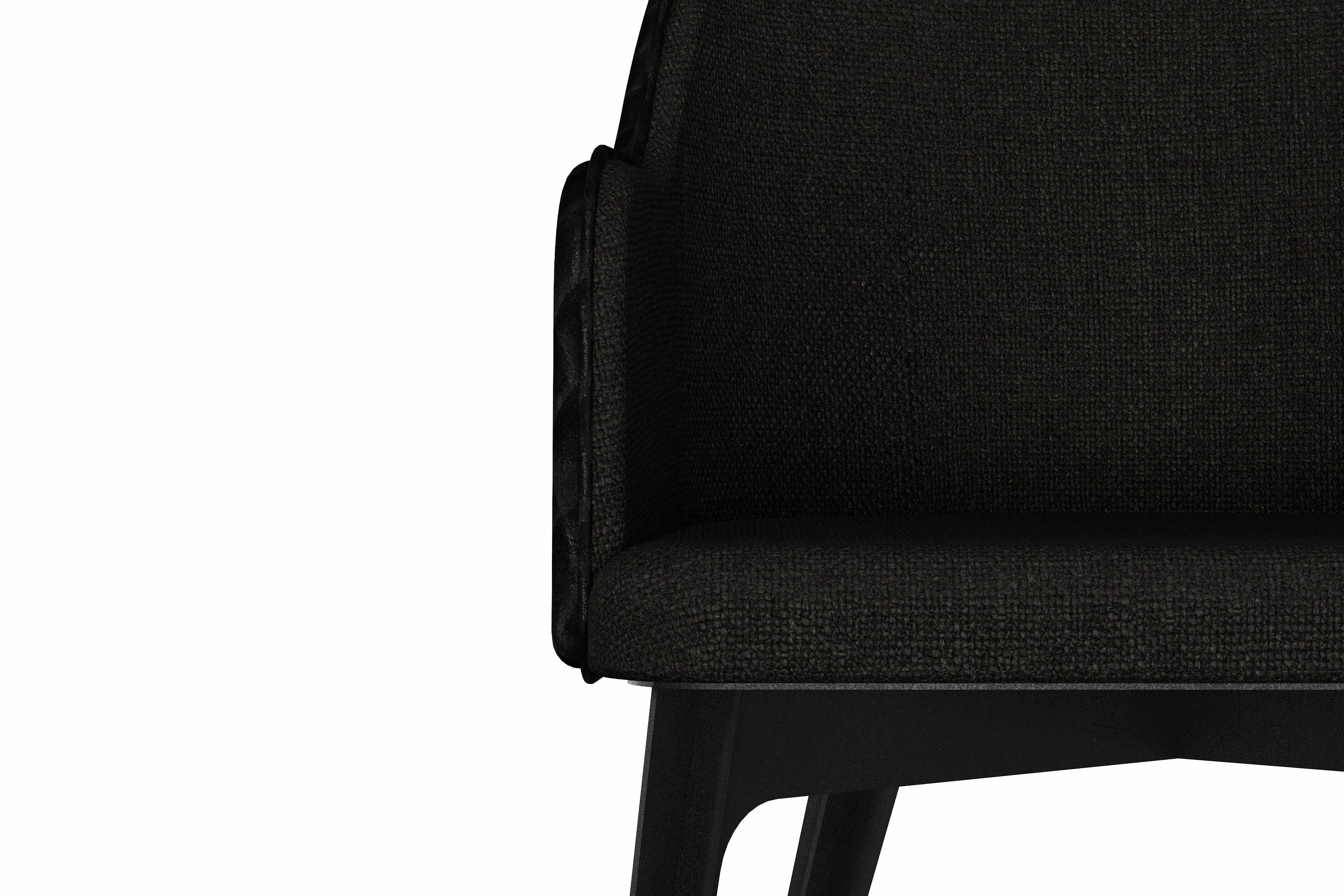 Care upholstered armchair with black steel legs For Sale 1