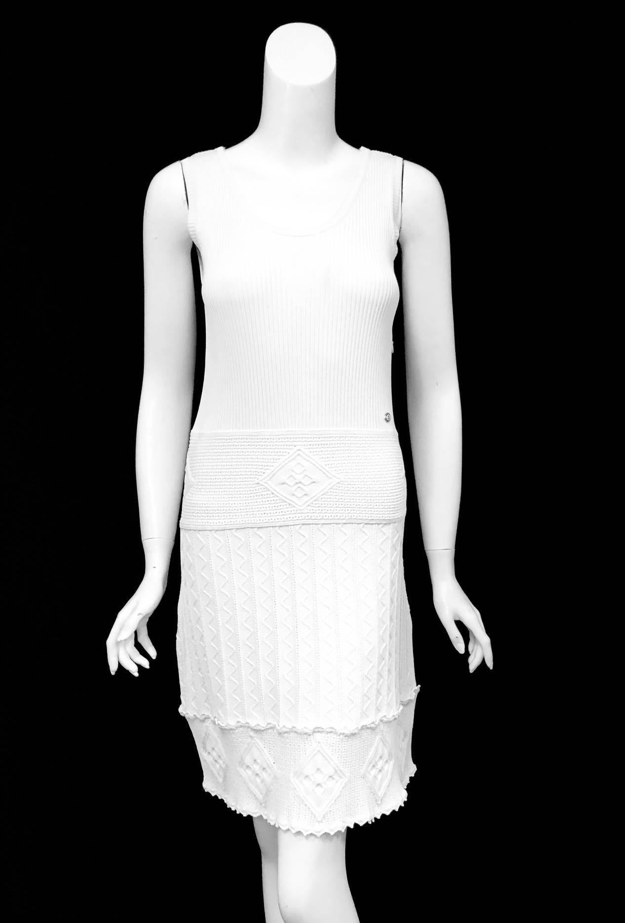 This Chanel white textured sleeveless knit dress with scoop neck is a great carefree dress for the spring continuing to the summer.  The knit is a giving stretch knit for added comfort and adaptable to your body.  This dress is not lined and has a