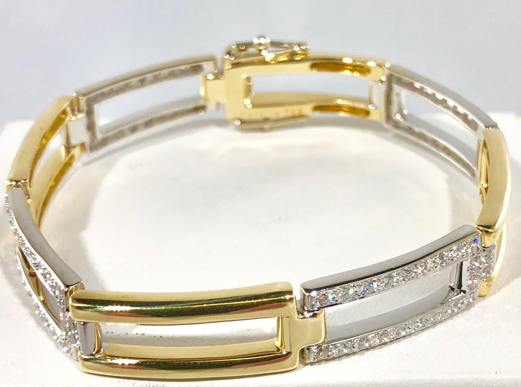 Carelle 18 karat two tone yellow and white gold and diamond bracelet. This piece sparkles with 88 full cut round diamonds equaling 1.73 carats total weight, Color F-G, Clarity VS1. Gold weight is 29.5 grams/ 19.0 dwt. length is 7 inches and 3/8 inch