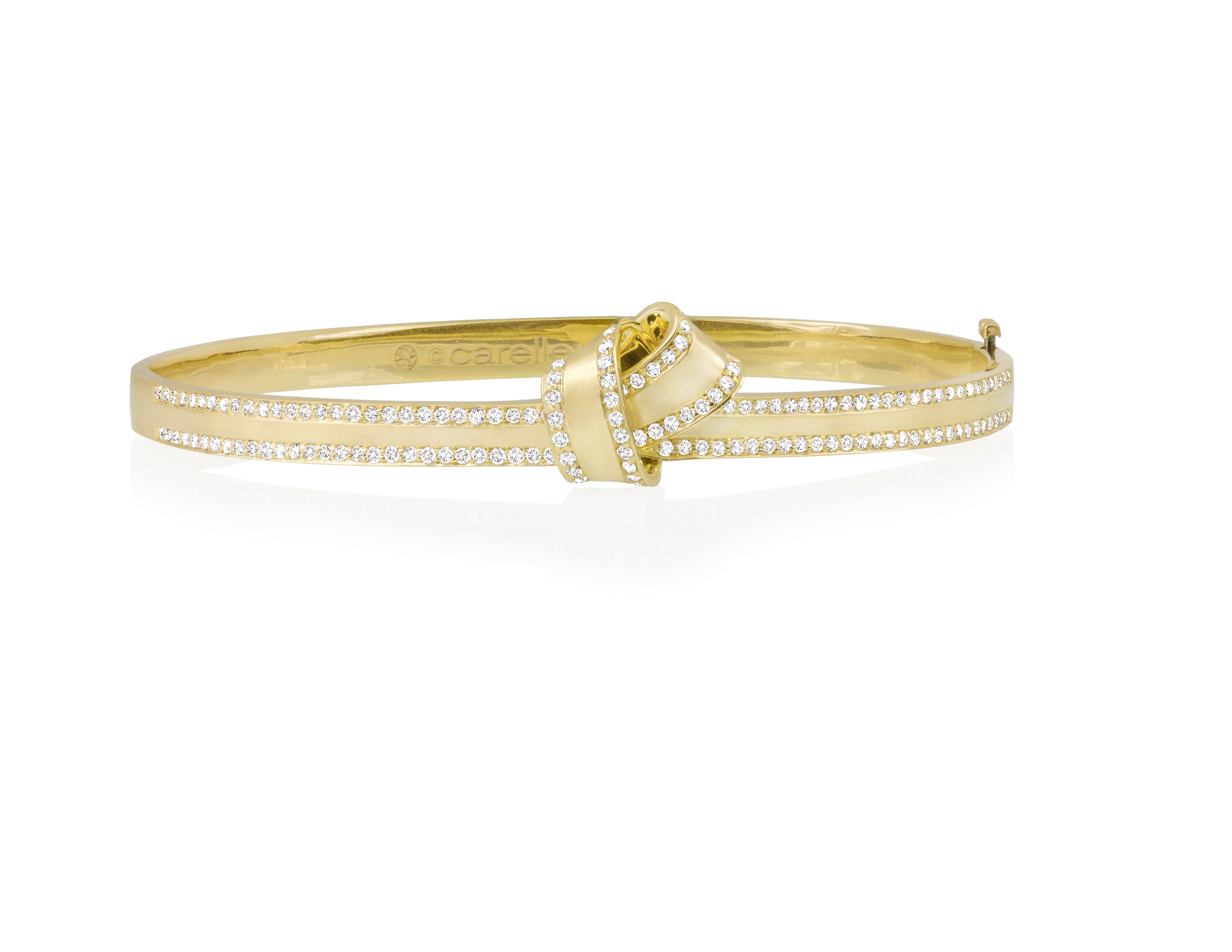 Simply stunning, these timeless designs tie together every look with a personalized touch of effortless elegance.

Outlined in sparkling pave diamond, folds of sumptuous 18k yellow gold encircle the wrist and intertwine creating a structured,