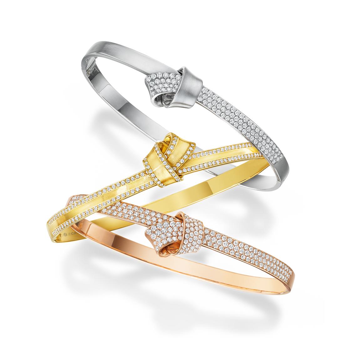 Women's or Men's Carelle 18 Karat Yellow Gold Brushed Satin Knot Diamond Trim Bangle For Sale