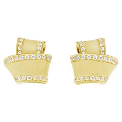 Carelle 18 Karat Yellow Gold Brushed Satin Knot Diamond Trim Stud Earrings