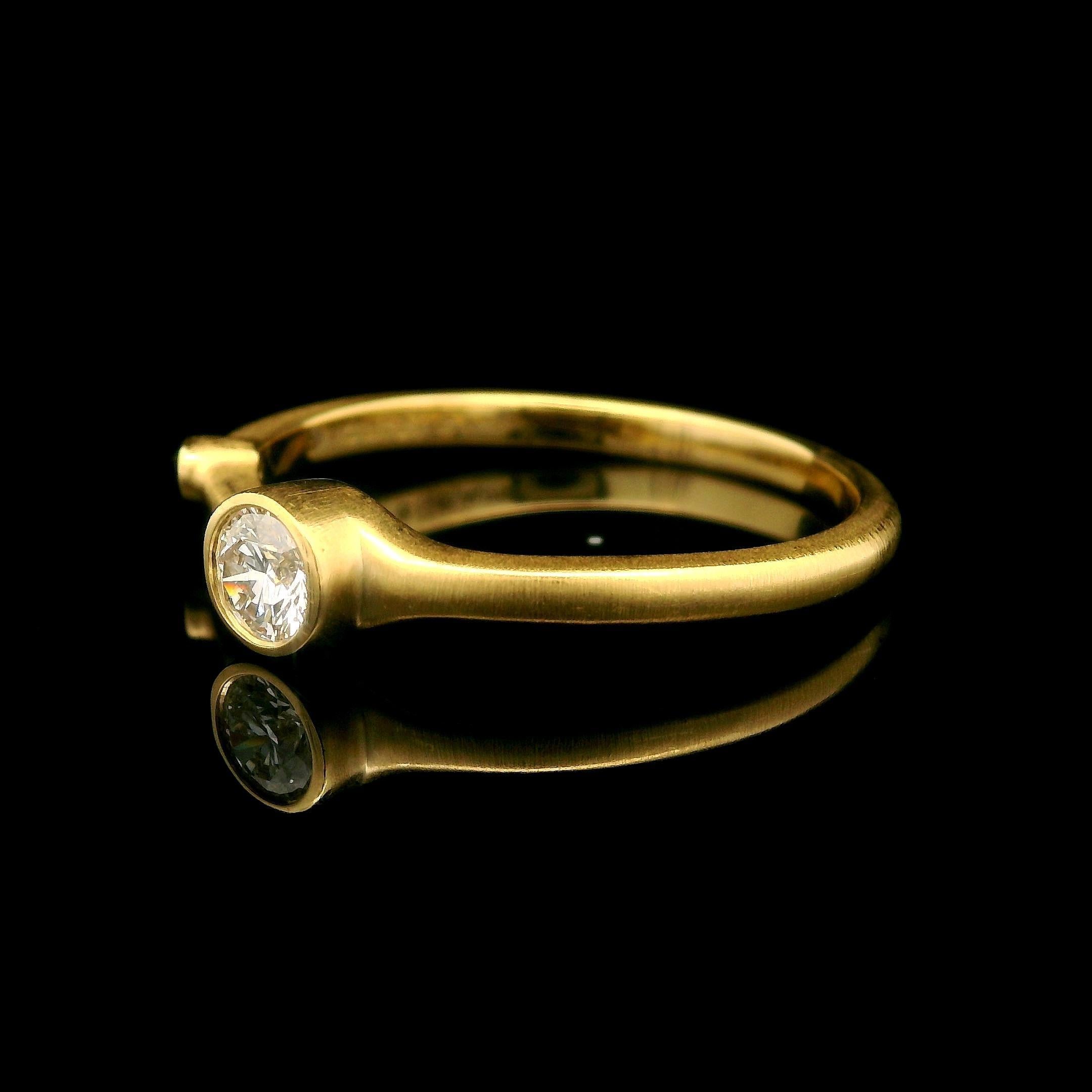 –Stone(s)–
(1) Natural Genuine Diamond - Round Brilliant Cut - Bezel Set - F Color - VS1 Clarity - 0.25ctw (exact-stamped)
(1) Natural Genuine Diamond - Round Brilliant Cut - Bezel Set - F Color - VS2 Clarity - 0.02ctw (approx.)

Material: Solid 18k