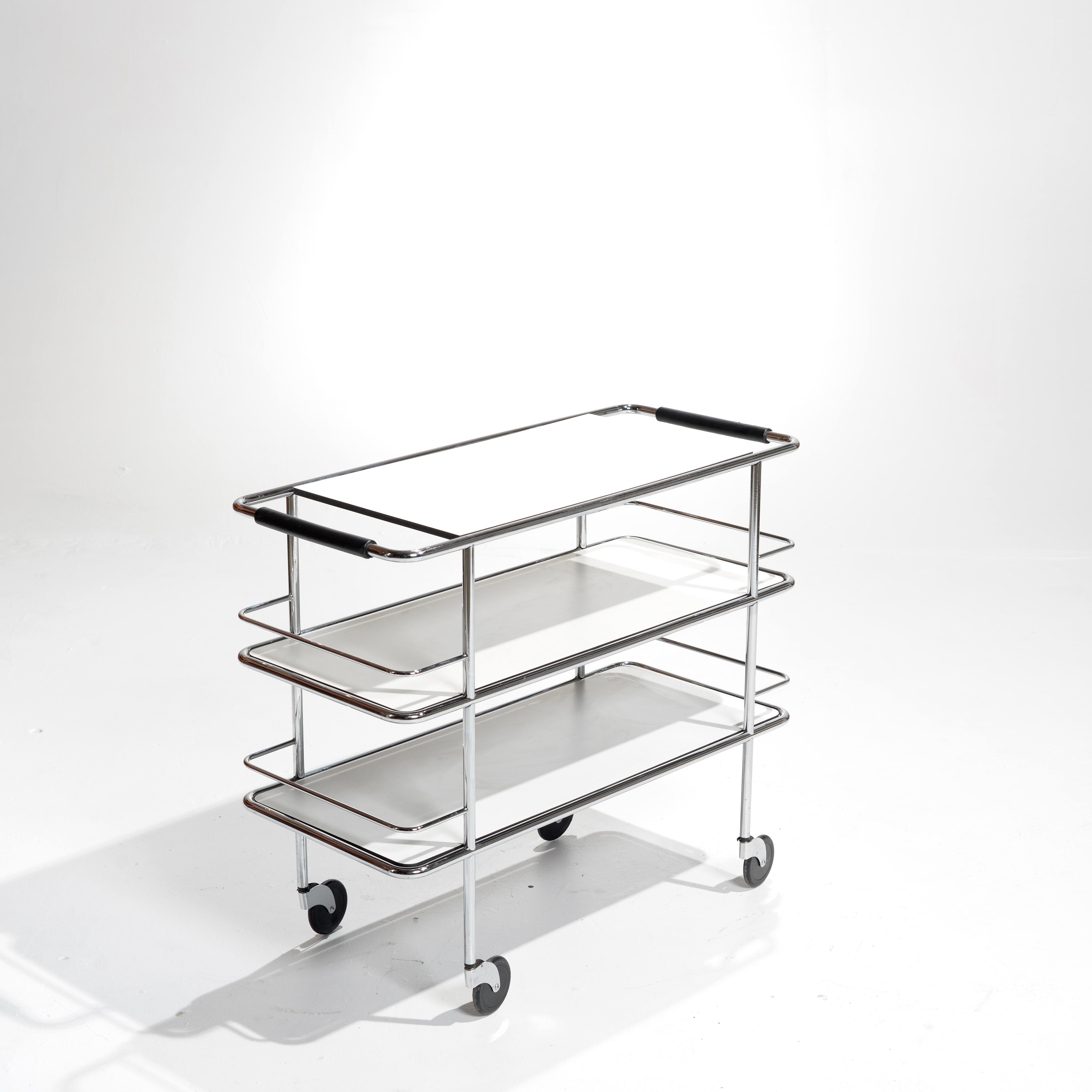 This cart brings utility and grace together, either as a sideboard in the home or as a bar or serving trolley around the dining areas of a restaurant.