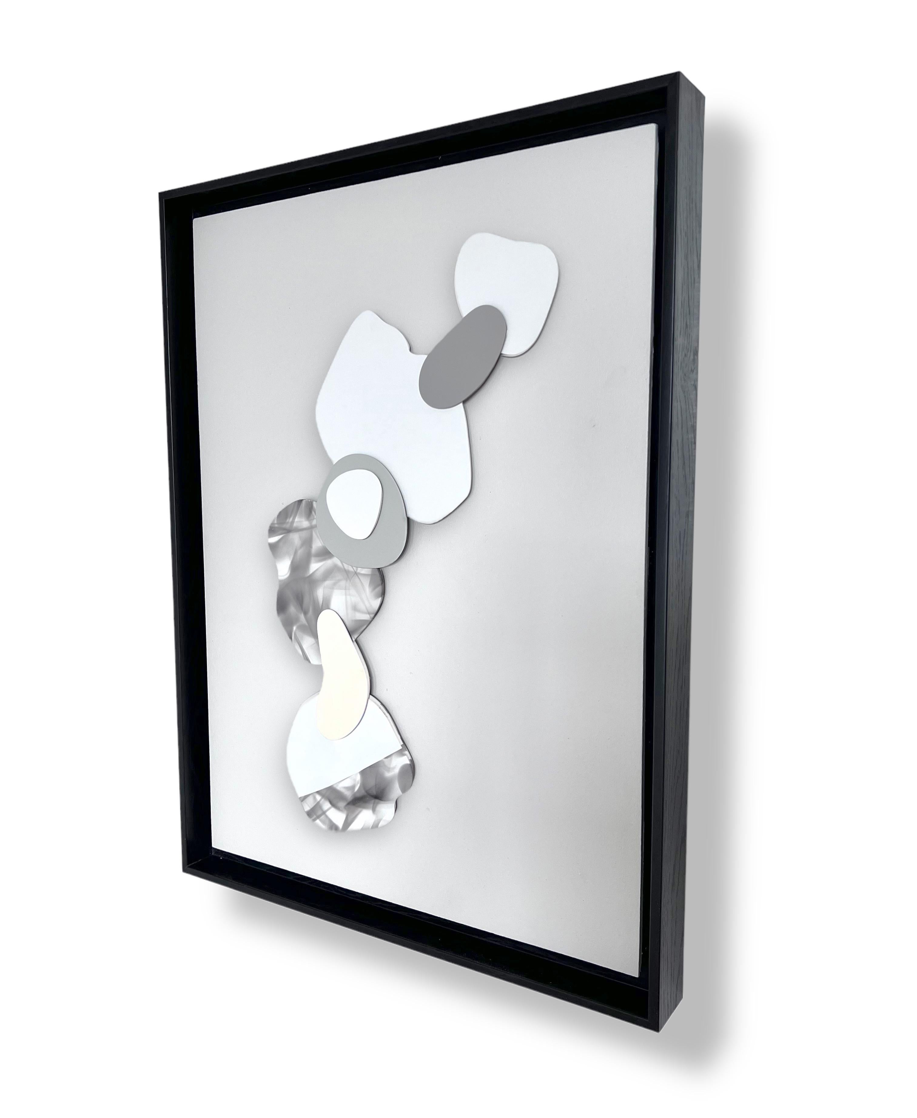 Clouds I . 2022 
Mixed Media abstract, minimalistic, 3D painting on wood panel mounted on a deep floater black frame  18.75H x 24.75W x 2D  
It is a 3D painting, composed of small pieces of plaster painted with neutral colors as well as smoke. The