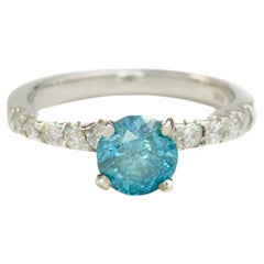 Caribbean Blue Diamond Ring with VS Diamonds on Band