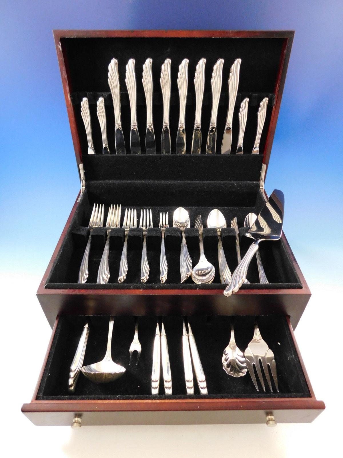 Reminiscent of ocean waves, Caribbean by Wallace sterling silver flatware set, 70 pieces. This set includes:

8 knives, 9