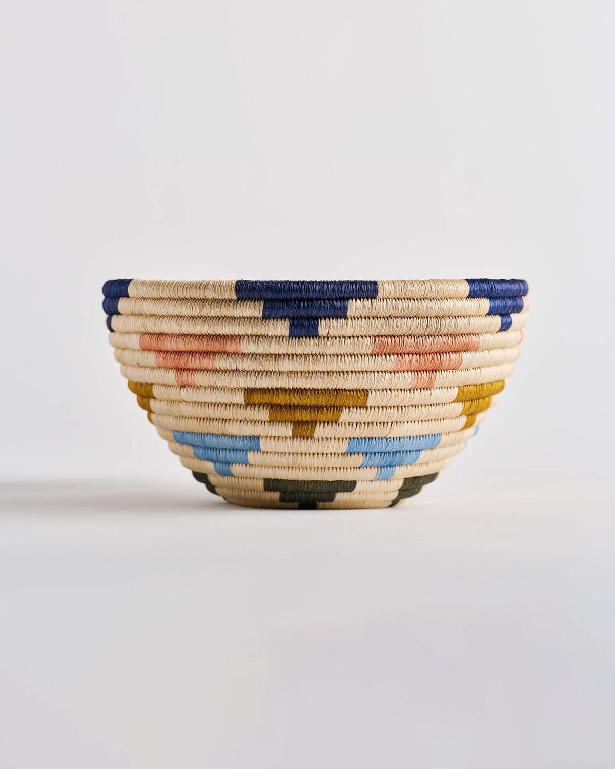 A colorful handwoven basket to decorate your kitchen table
This design showcases lively Caribbean colors of blues, greens, and pinks, bringing energy and brightness into our homes no matter the weather. Make it extra fun by pairing this multi-color