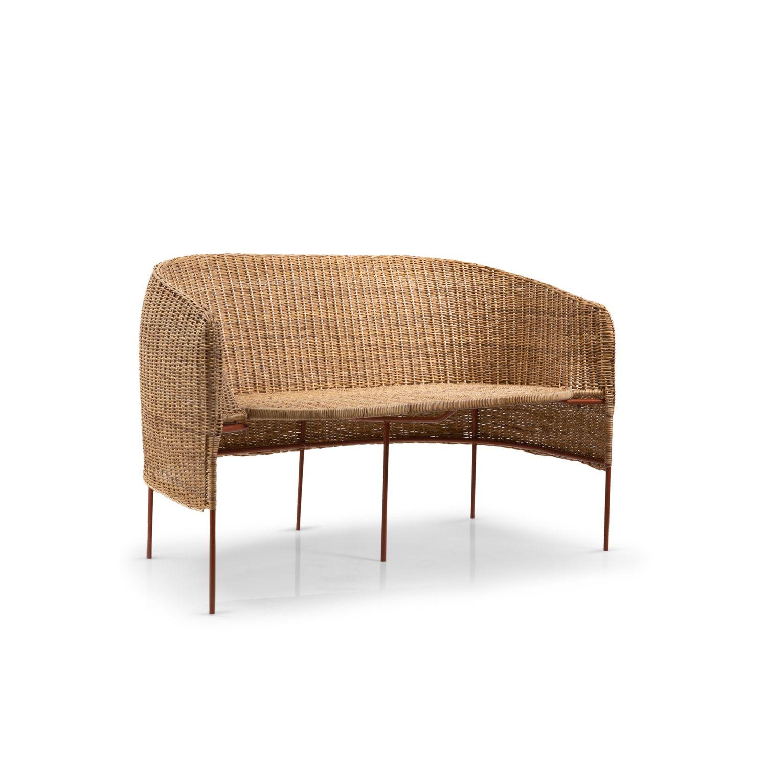 Caribe natural 2 seater bank by Sebastian Herkner
Materials: Wicker from Bejuco roots. Galvanized and powder-coated tubular steel frame.
Technique: Weaved by local craftspeople in Colombia. 
Dimensions: W 112.3 x D 69.6 x H 72 cm 
Available in