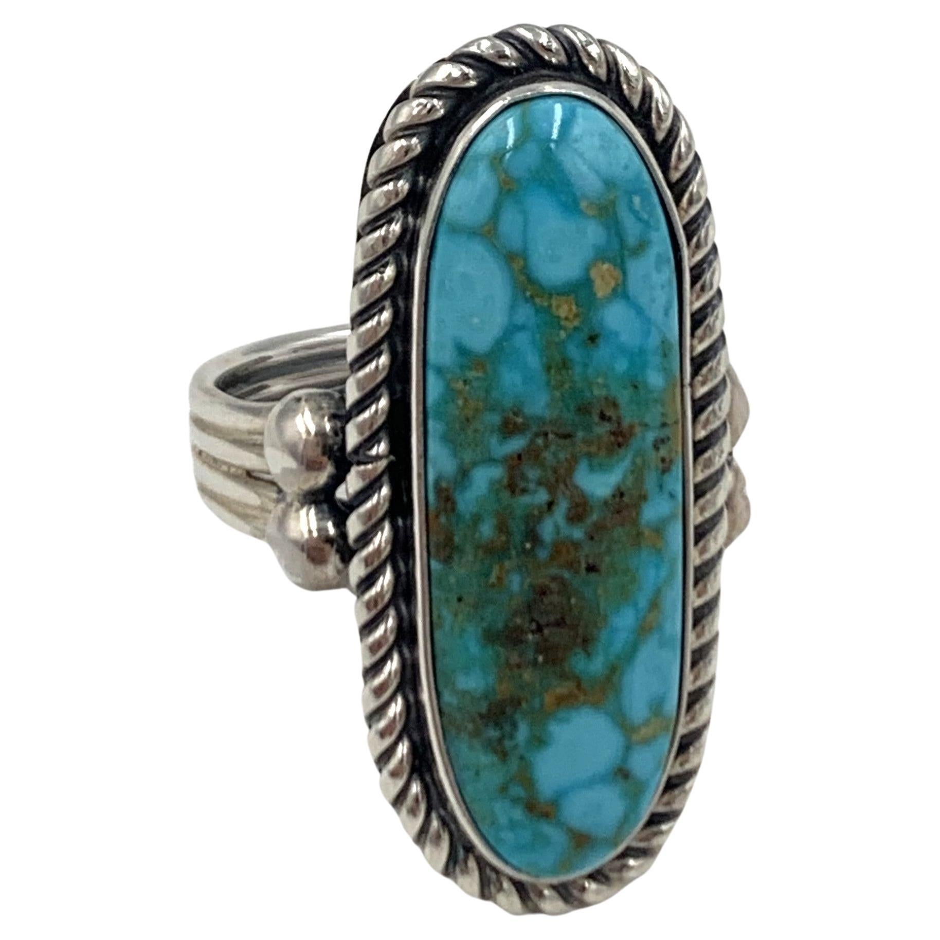 Carico Lake Turquiose Ring with Sterling Silver. Created by Navajo Silversmith Alfred Lee. 

The Carico Lake mine is named after the dried up lake bed in Nevada where this unique material is mined. The mine produces a wide variety of turquoise