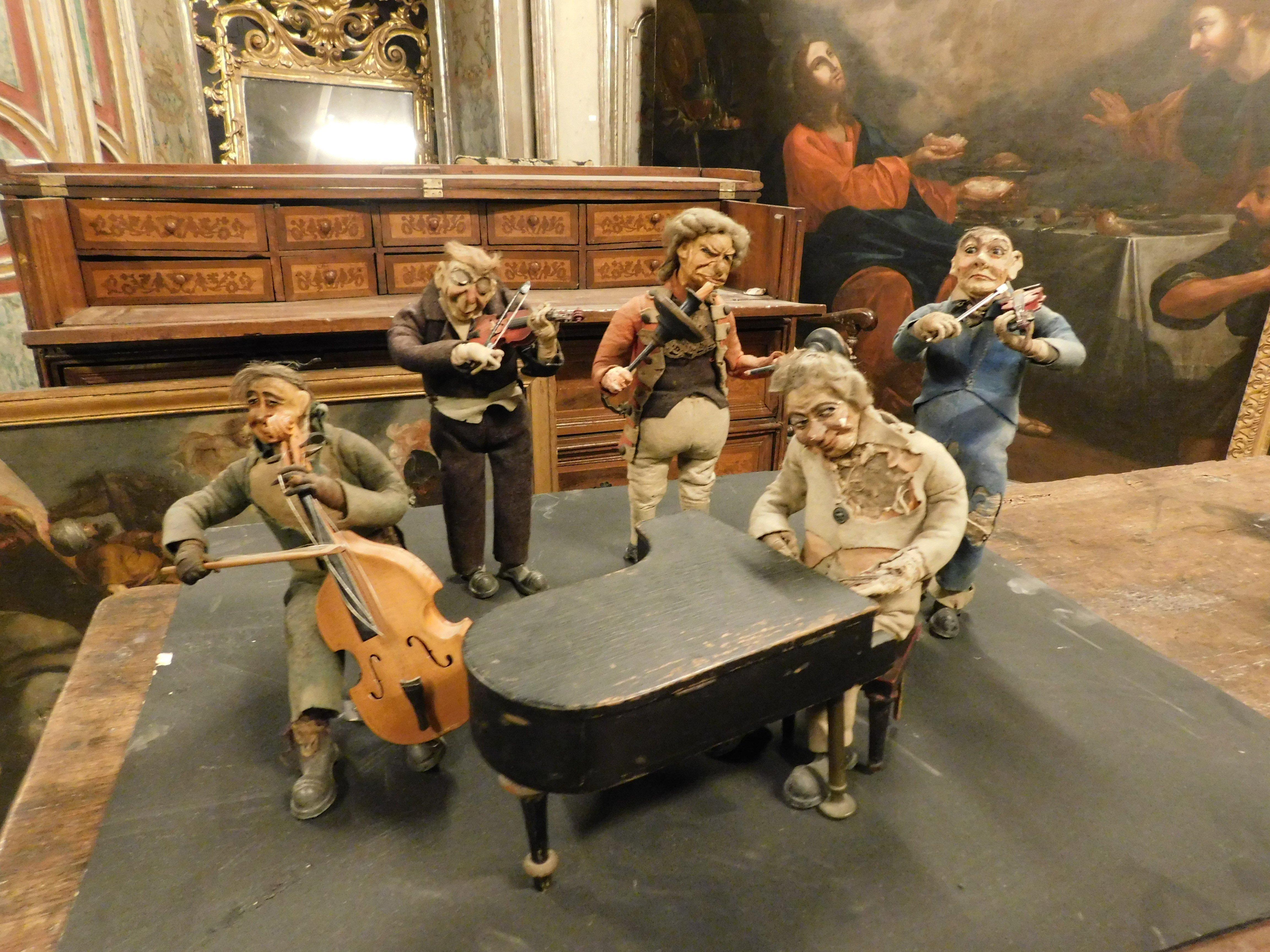 Italian Carillon of five rag musicians, cloth body, iron feet, papier-mâché head, Italy