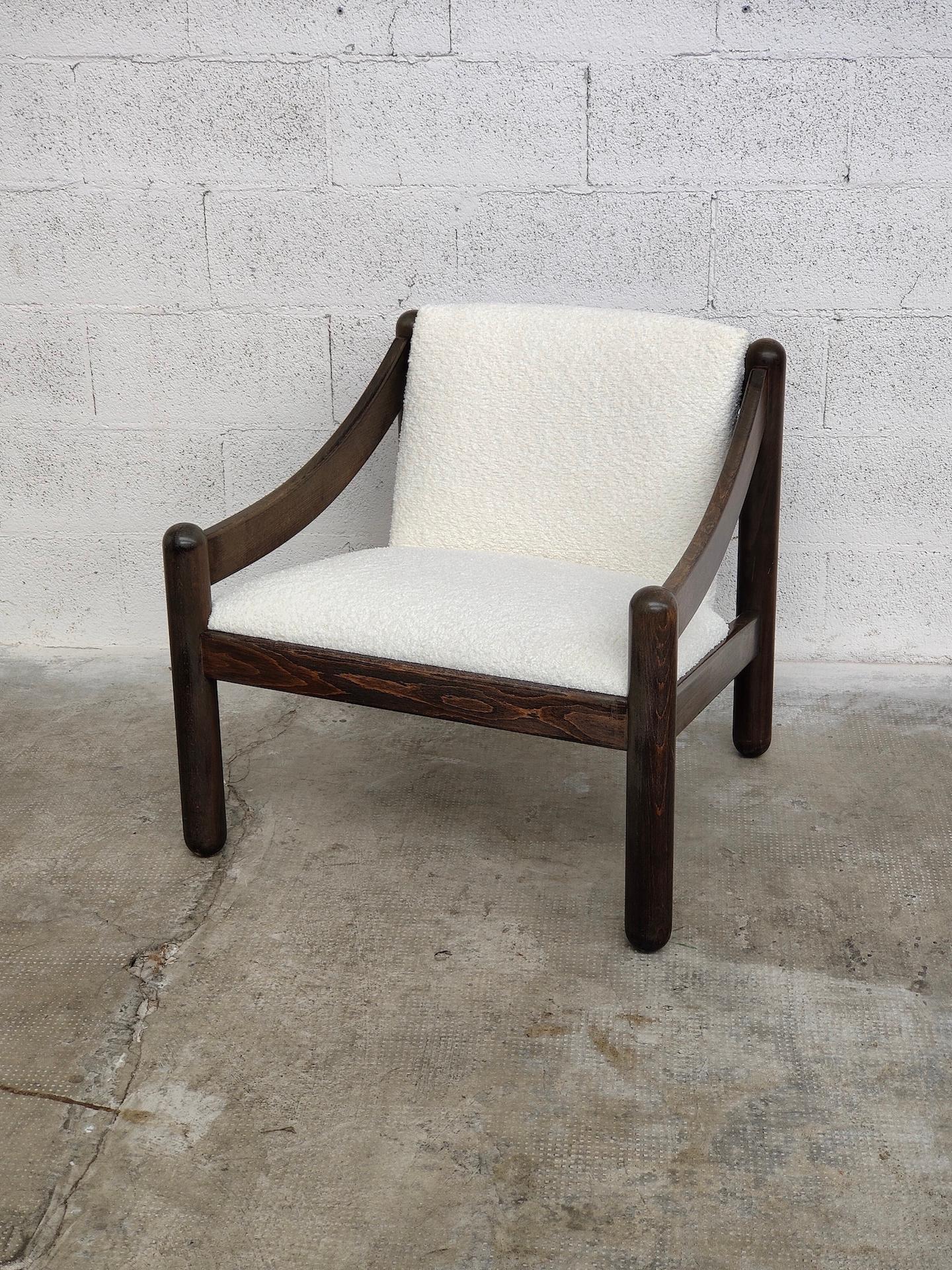 Model 930 armchair for the Carimate Golf Club-House, Cassina production design Vico Magistretti year 1963. Structure in brown beech wood, seat and back in white bouclè upholstery. Manufacturing label under the frame.

Cassina Spa is an Italian