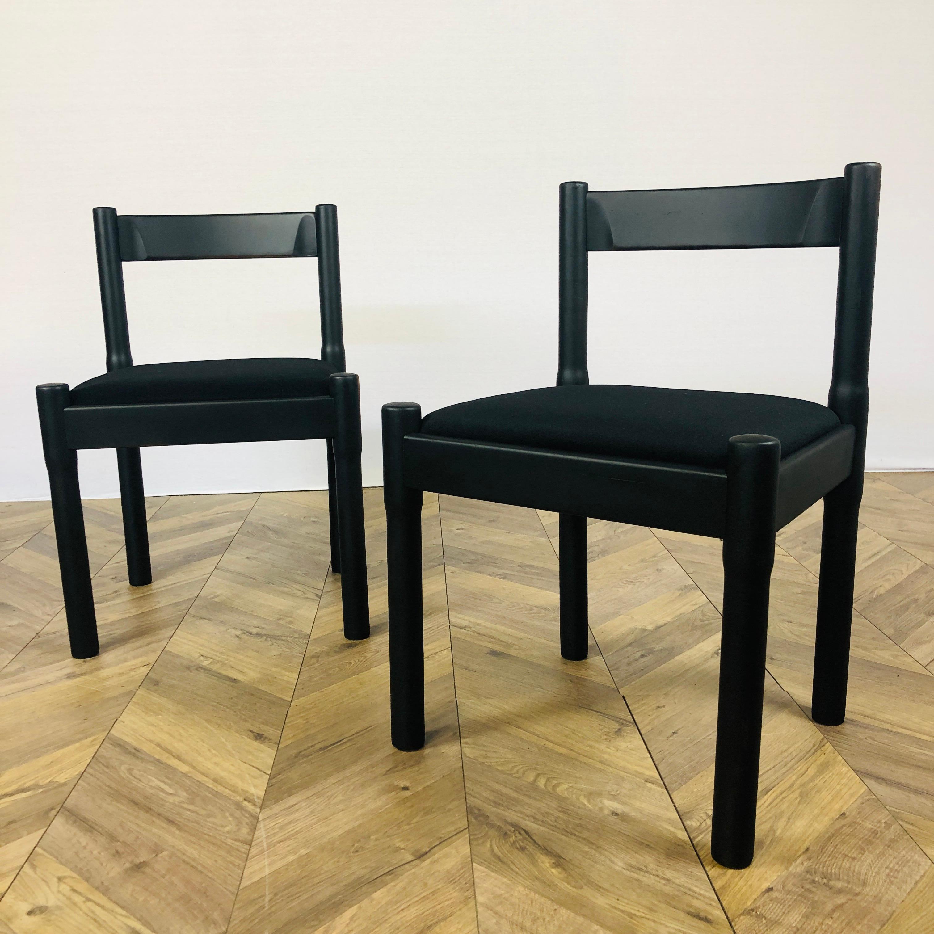 A Set of 2, super stylish Modernist chairs, Manufactured by Cassina in Italy. 

The iconic Carimate chair was designed by influential designer & architect Vico Magistretti in 1959 for the Club House of the Carimate Golf Club in Lombardy. 

It