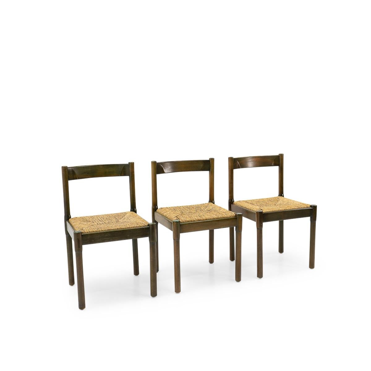 Please note only one chair left:

Original Carimate chairs designed by Vico Magistretti, produced by F.li Mario Luigi Comi during the 1960s. 

The chairs were originally aniline dyed in green, and due to the influence of time and sunlight they have