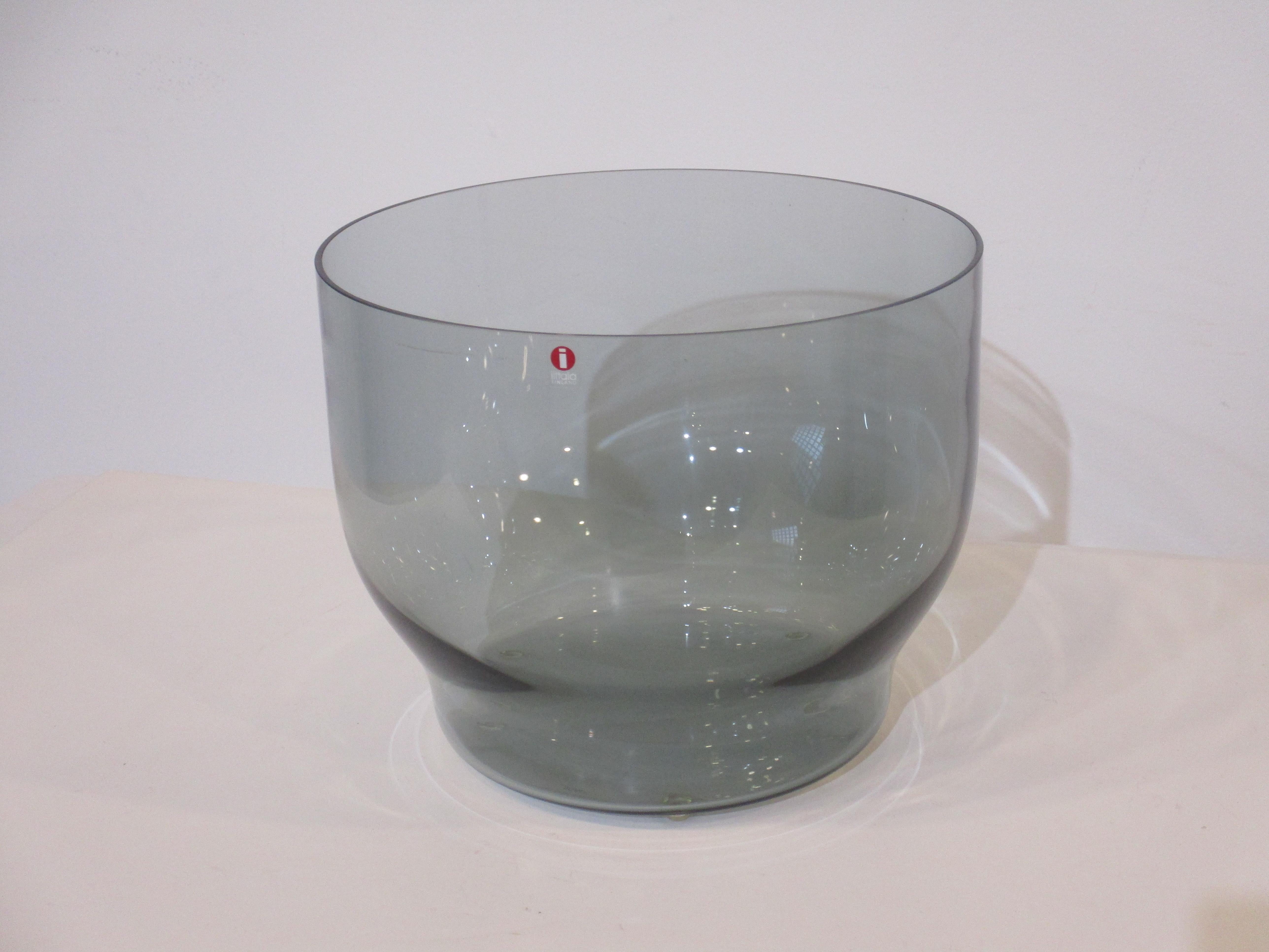 A large smoked glass decorative center piece bowl designed by Carina Seth Andersson for Iittala made in Finland . A light and airy feel just the right piece for your table with that touch of Scandinavian style.