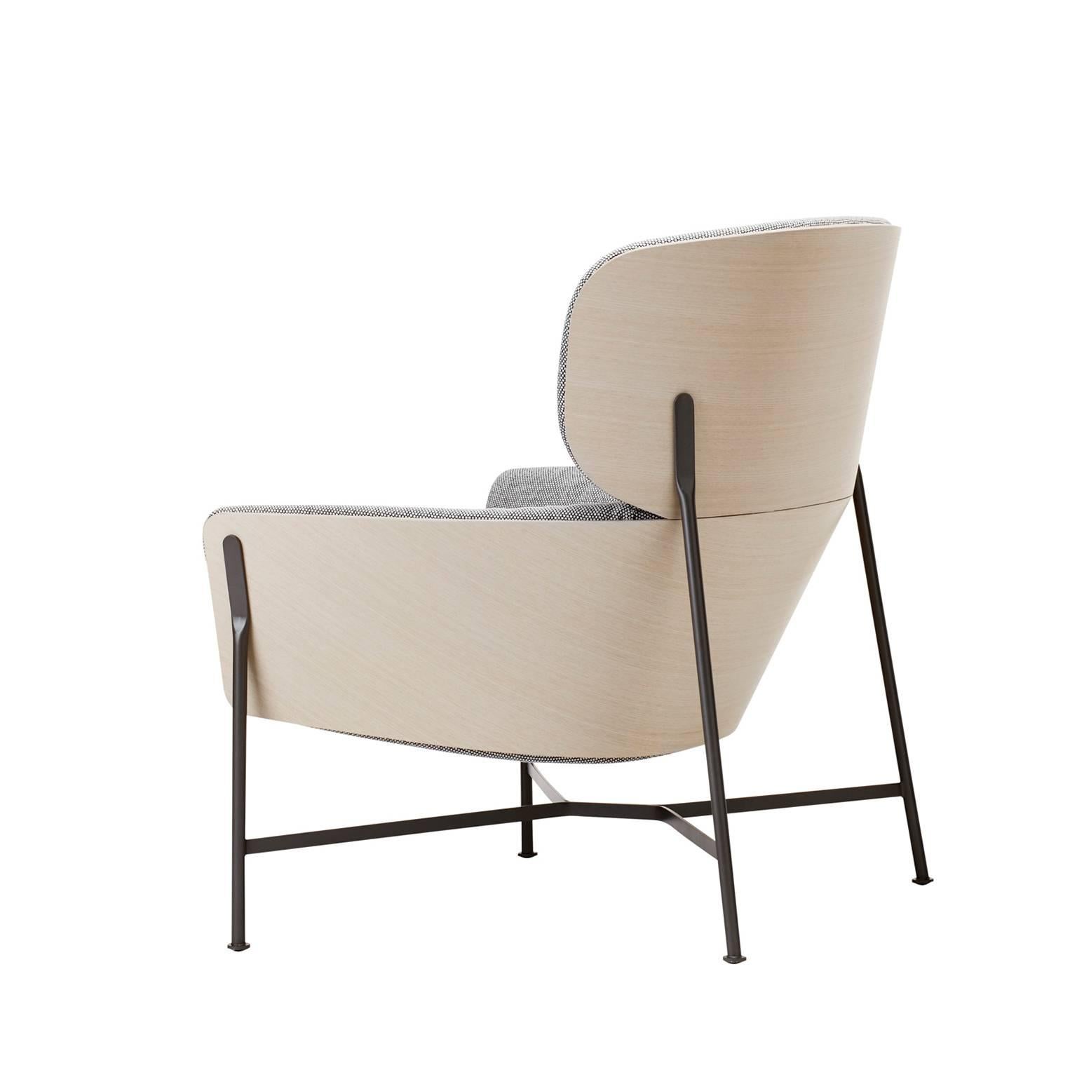 A re-interpretation of the wingback chair that would be right at home in a Palm Springs pad or a harbourside home. The contoured timber shell and soft upholstery are cradled within a sleek steel frame. Available with a high or low